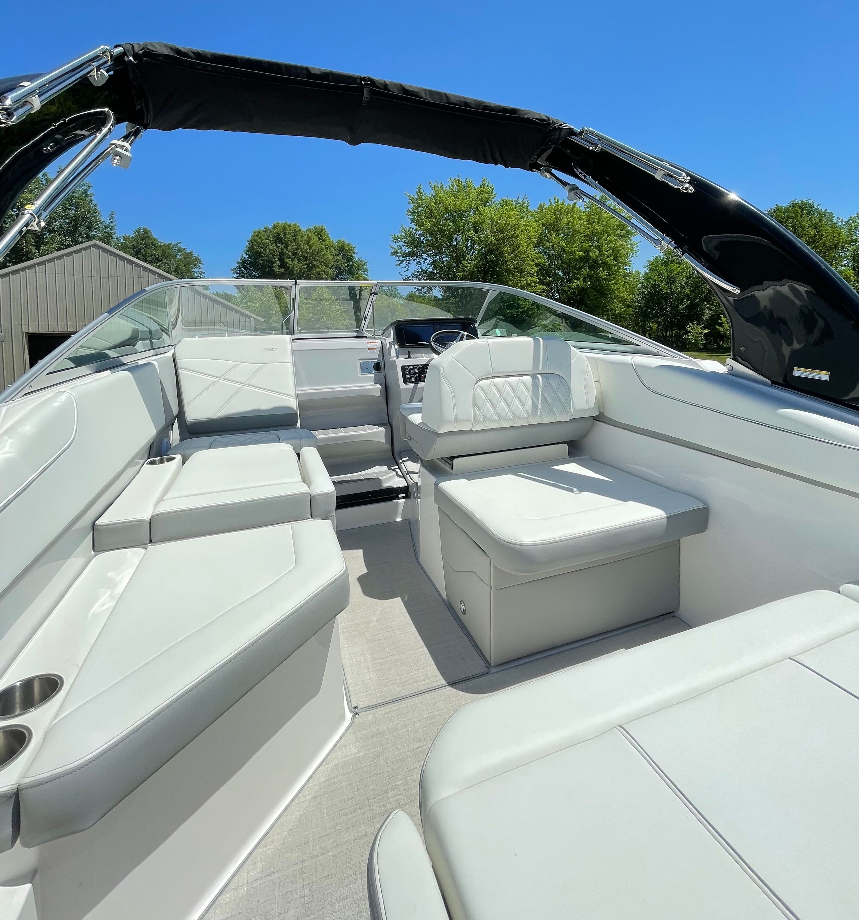 Interior of a 2022 Regal 26 Express boat with white seating.