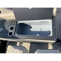 2025 Ranger Reata 223FC boat console with cup holders and storage compartment.