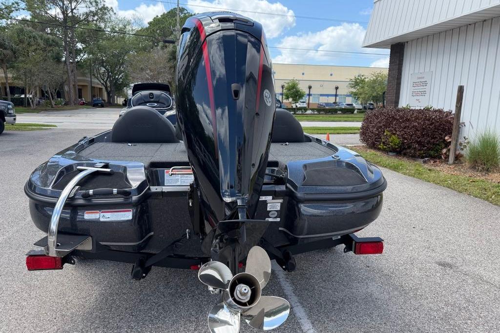 Rear view of a 2026 Nitro Z17 boat with an outboard motor.
