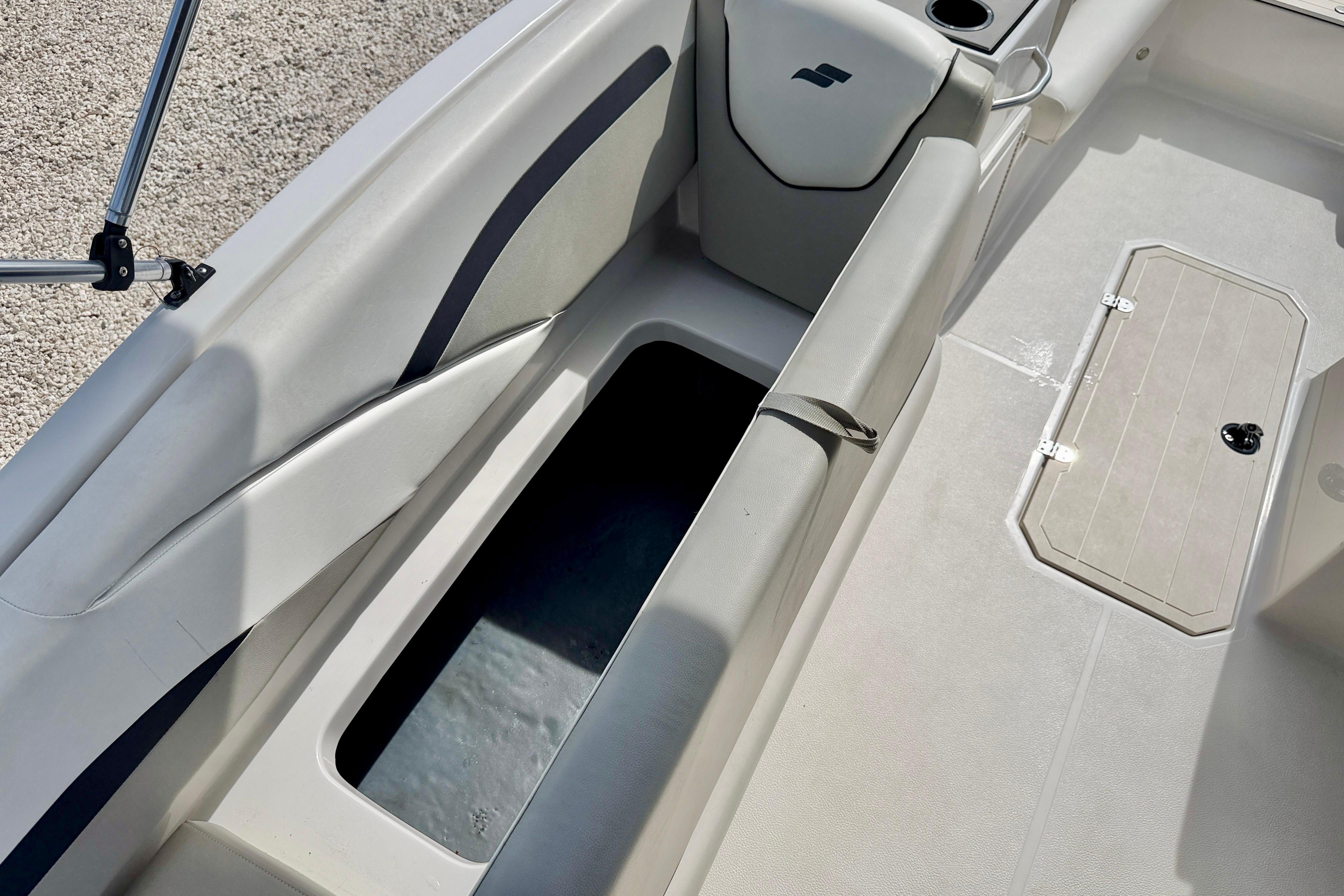 2021 Starcraft SVX 191 OB boat interior with open storage compartment and seating.
