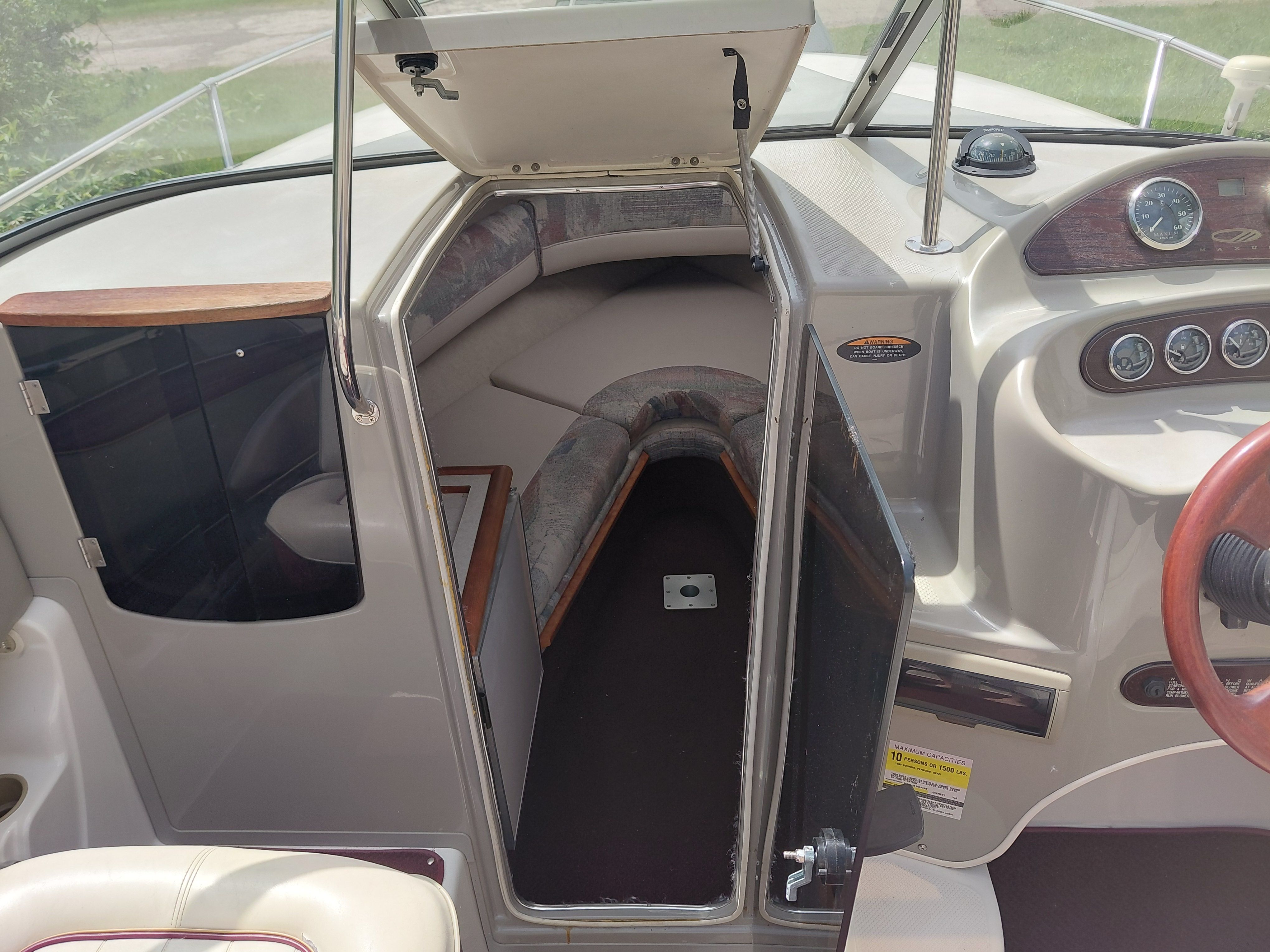 Interior of a 1997 Maxum 2300 SC with cabin and helm station.