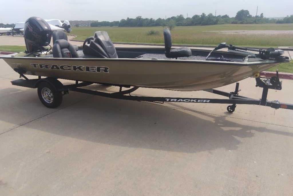 2026 Tracker Pro Team 190 boat on trailer, parked outdoors on concrete surface.