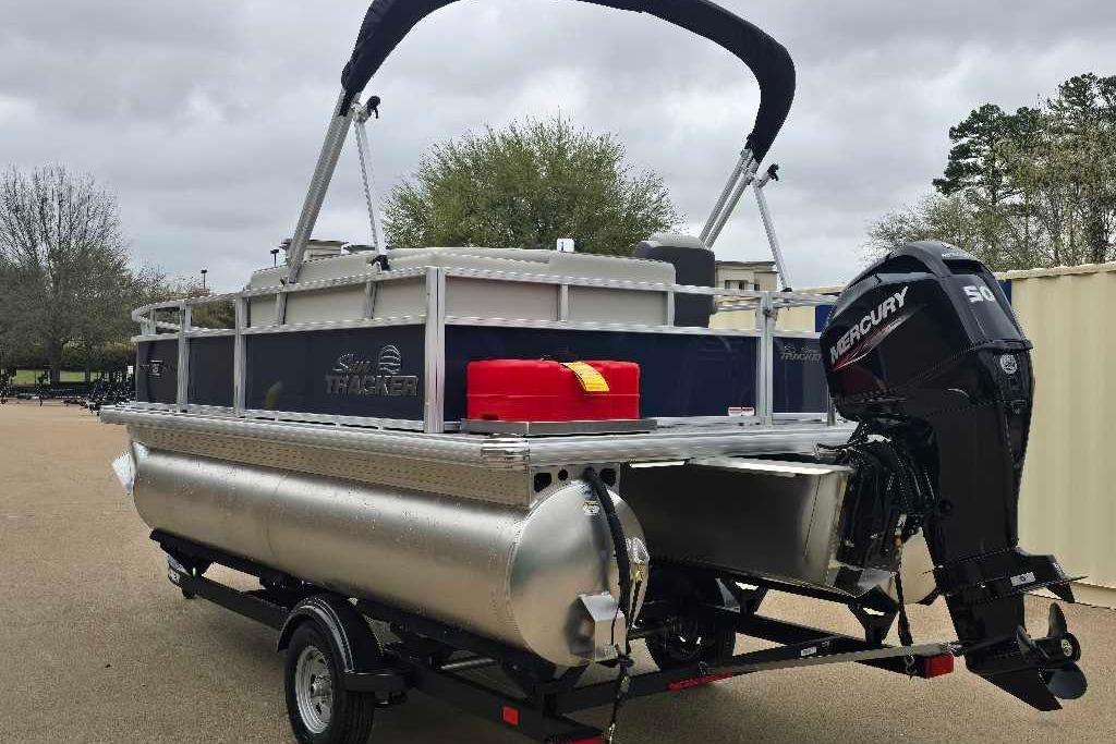 2026 Sun Tracker Bass Buggy 16 XL Select pontoon boat with Mercury outboard motor.
