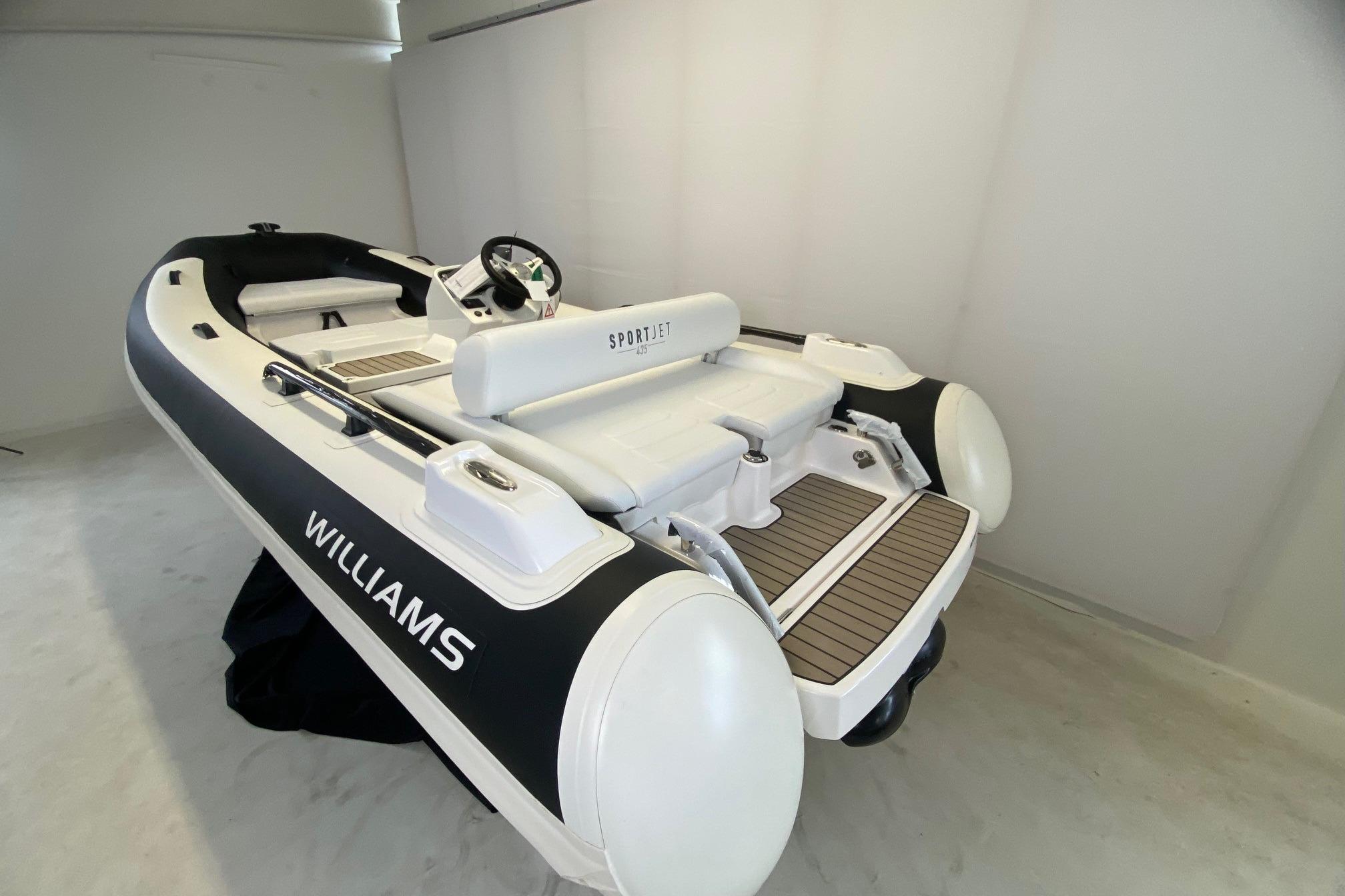 2025 Williams Jet Tenders Sportjet 435, sleek design in a showroom setting.