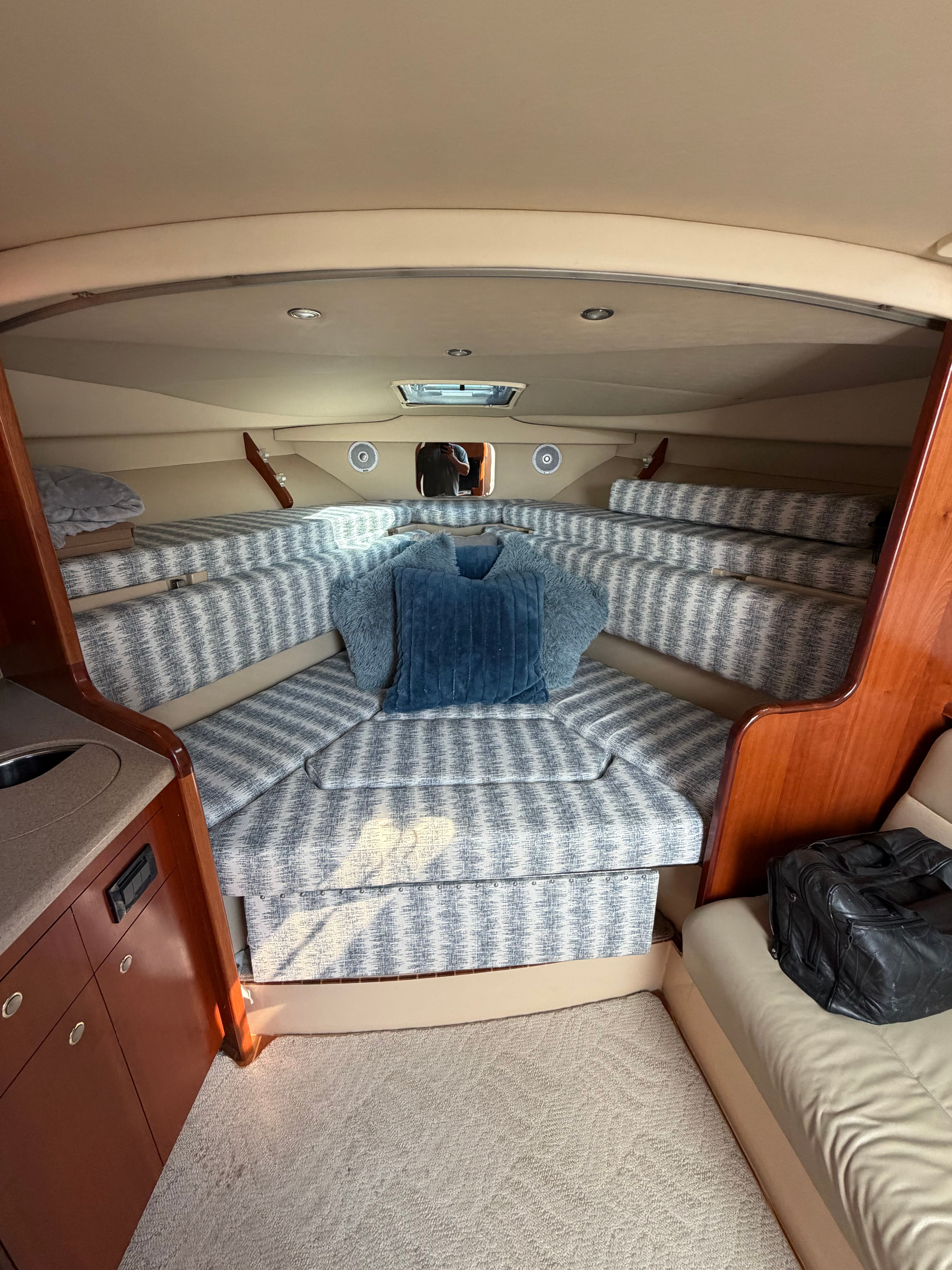 Interior of a 2005 Rampage 33 Express yacht with cozy sleeping area.