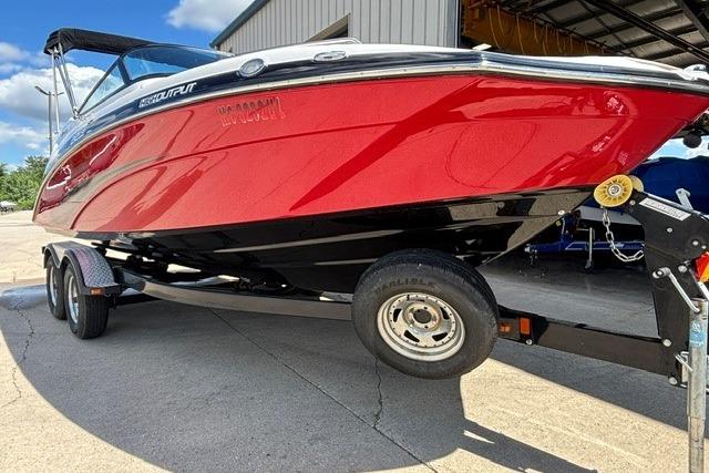 2014 Yamaha Boats 212X in red on a trailer, parked outdoors.