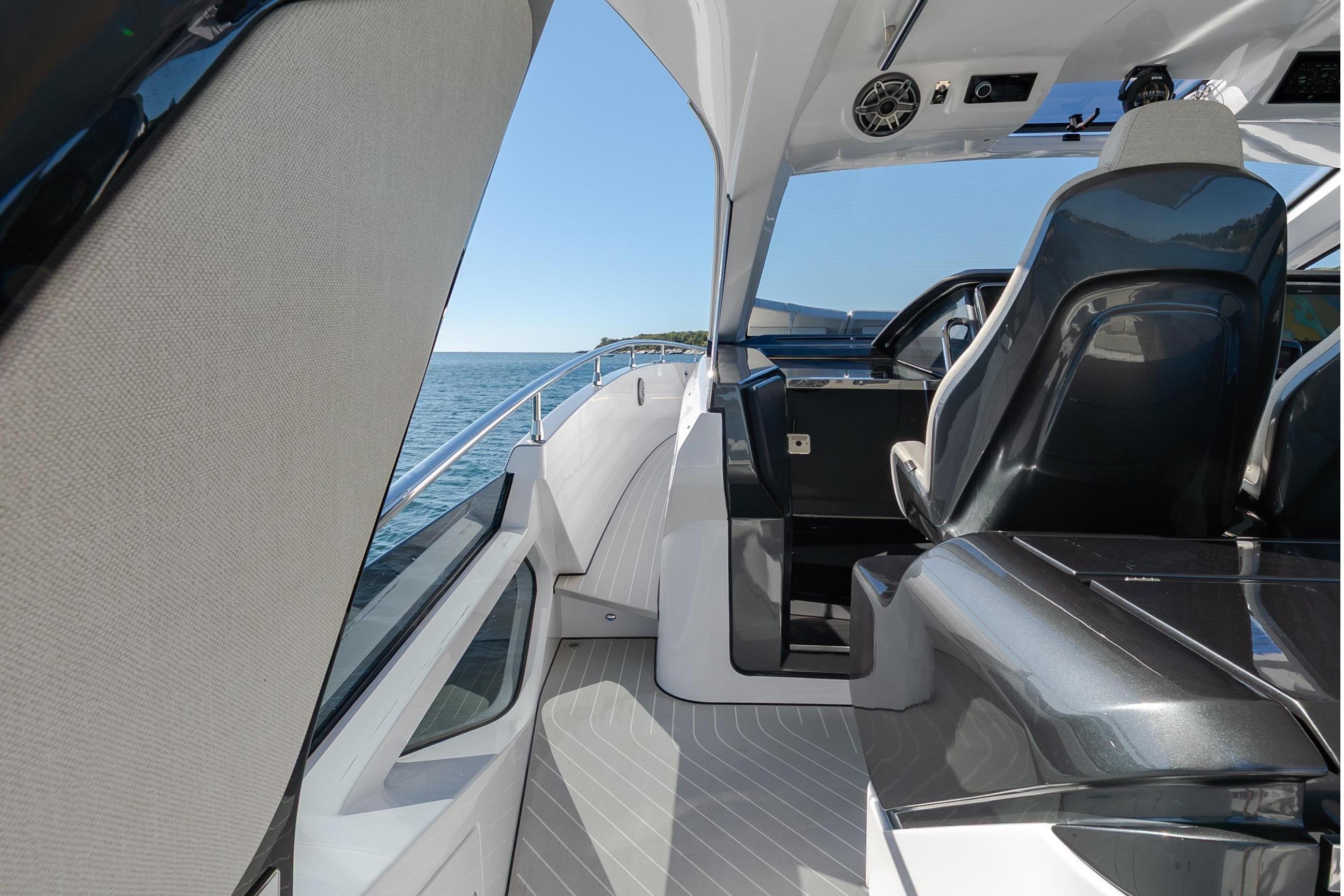 The 2023 Azimut Verve 47 features a modern cockpit with sleek seating and a clear view of the sea.