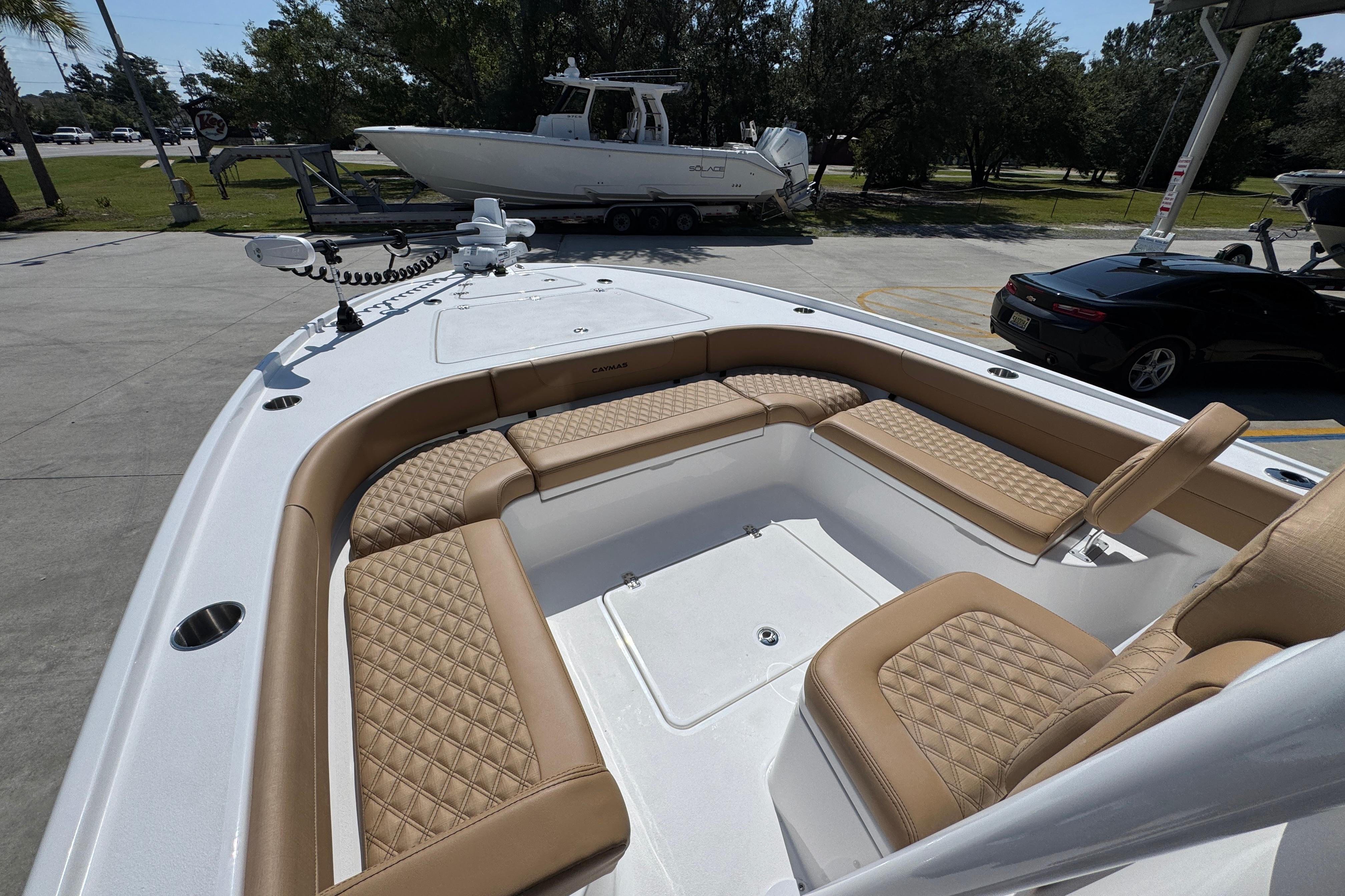 2027 Caymas 26 HB boat with luxurious tan seating and spacious deck layout.