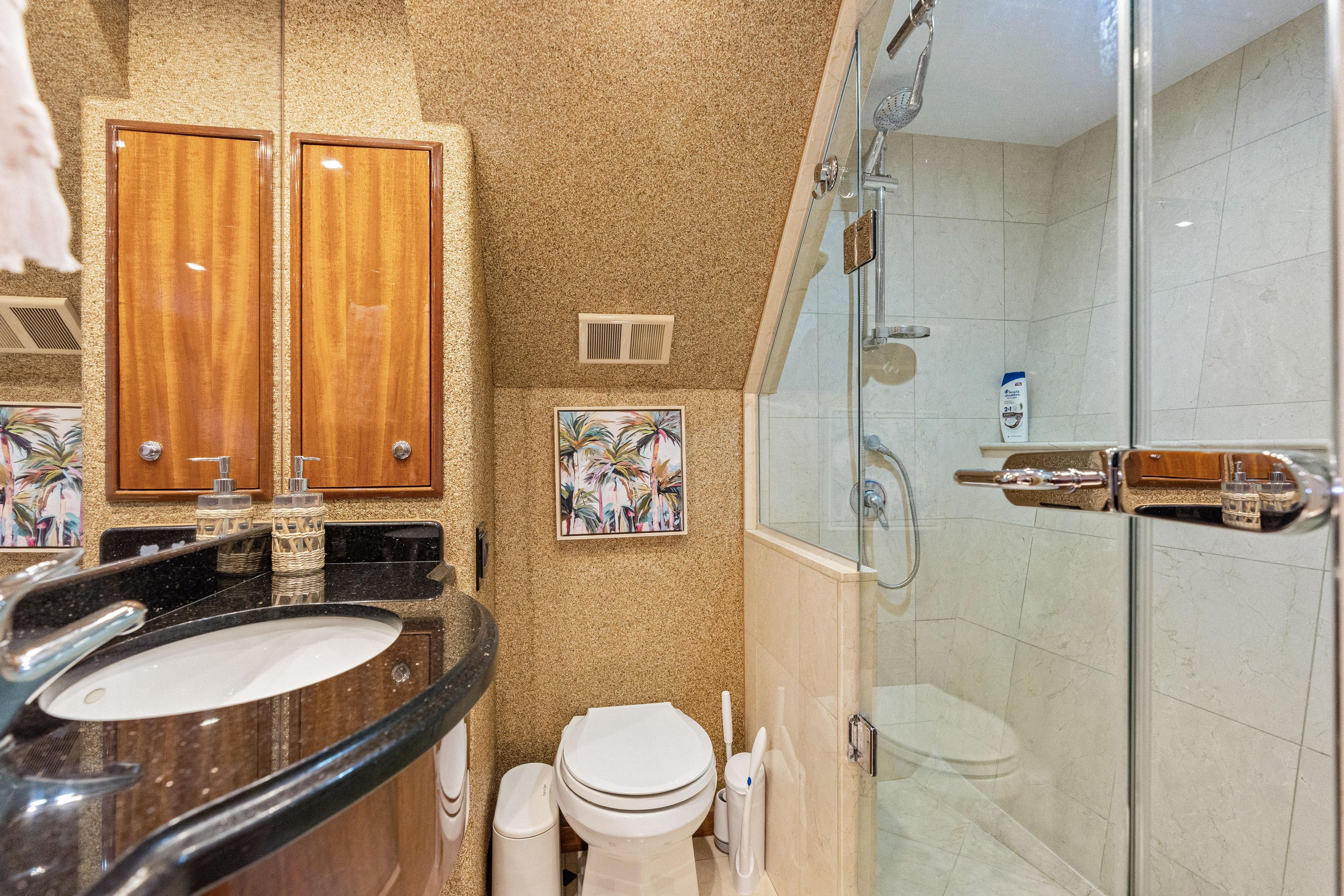 Luxurious bathroom in 2008 Hatteras 64 Motor Yacht with modern fixtures and elegant design.