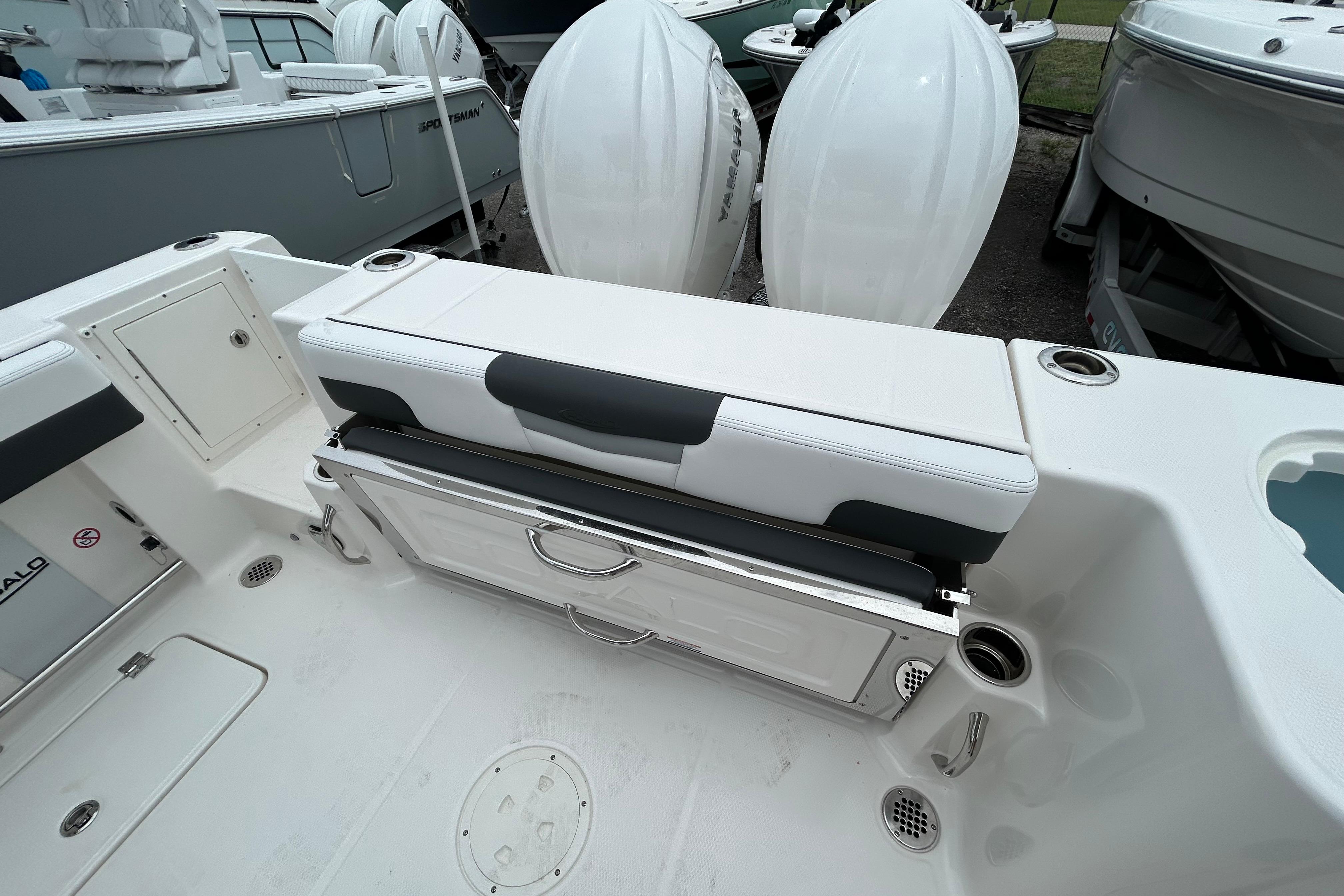 2026 Robalo R277 Dual Console boat interior with seating and storage compartments.
