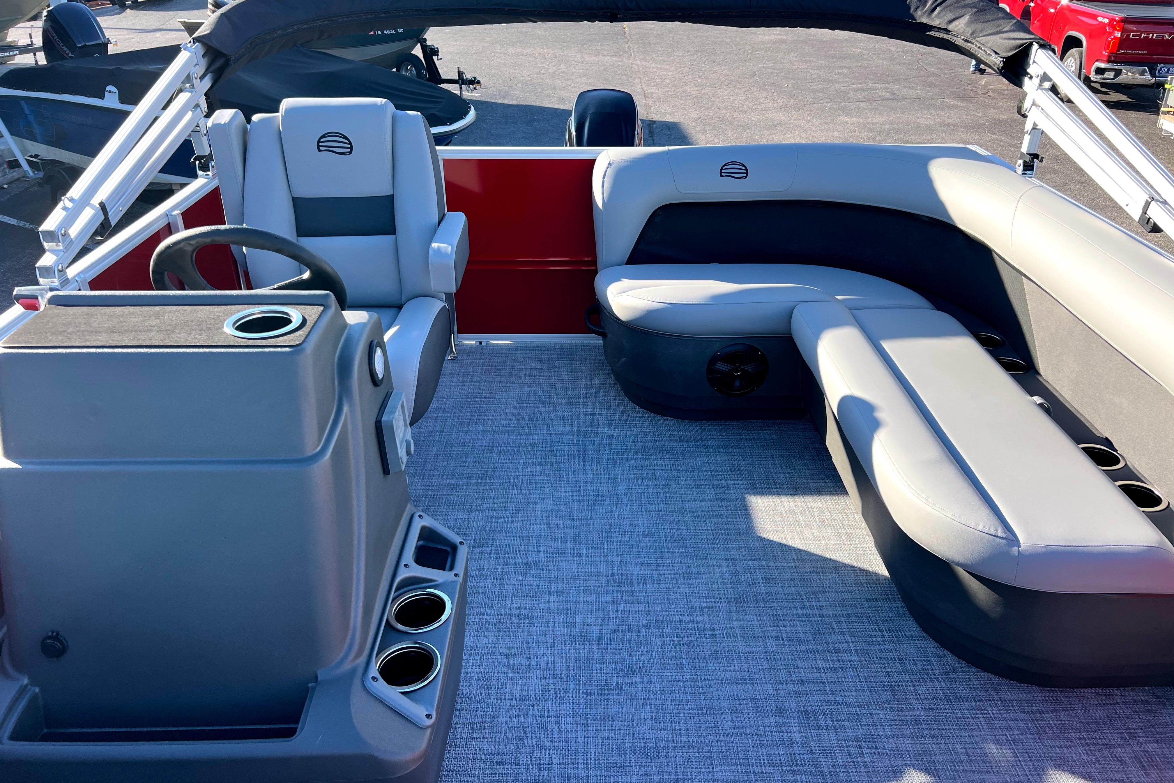 2026 Sun Tracker Party Barge 16 DLX interior with seating and steering console.