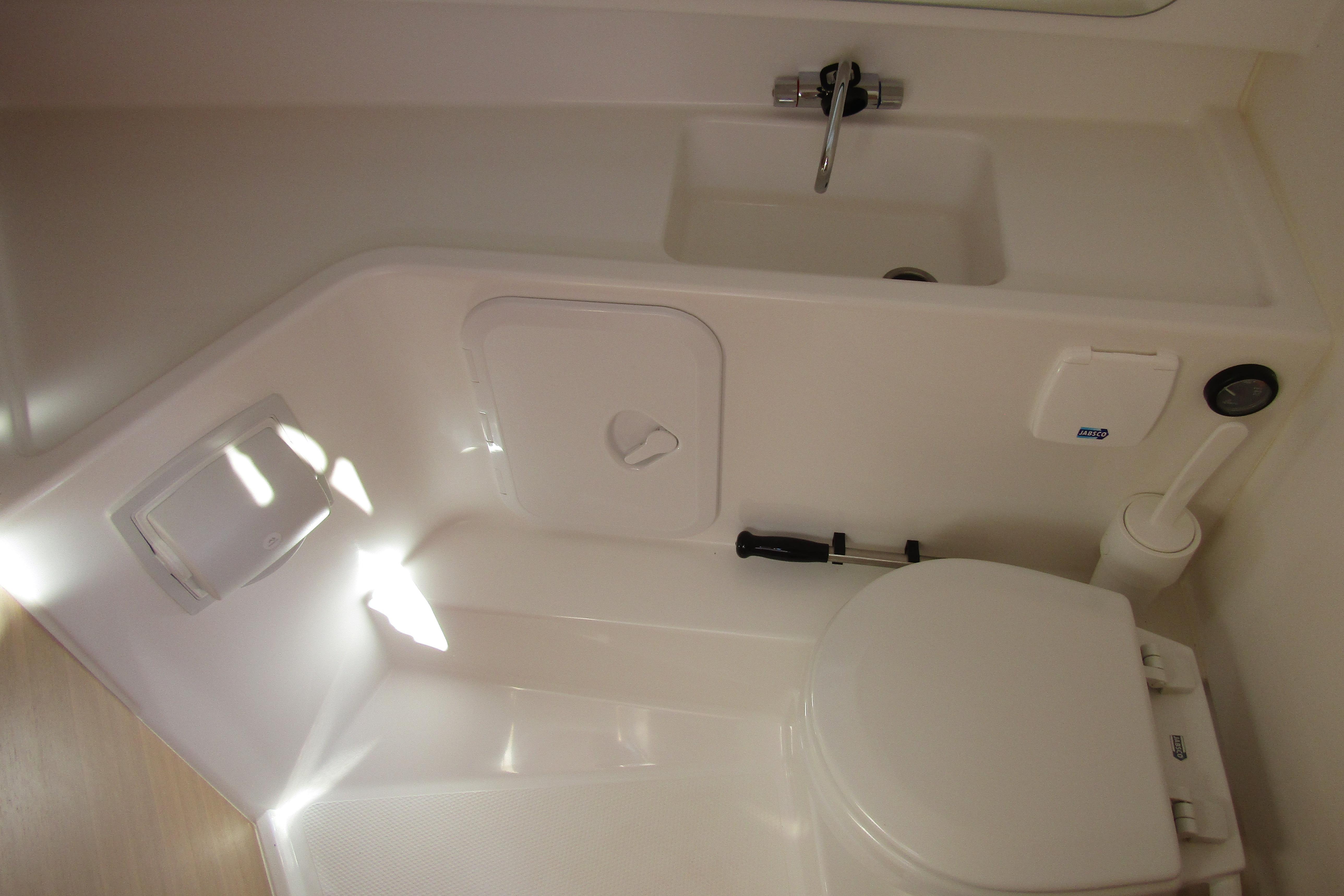Interior of Nimbus Tender 9, 2026, featuring toilet and sink.