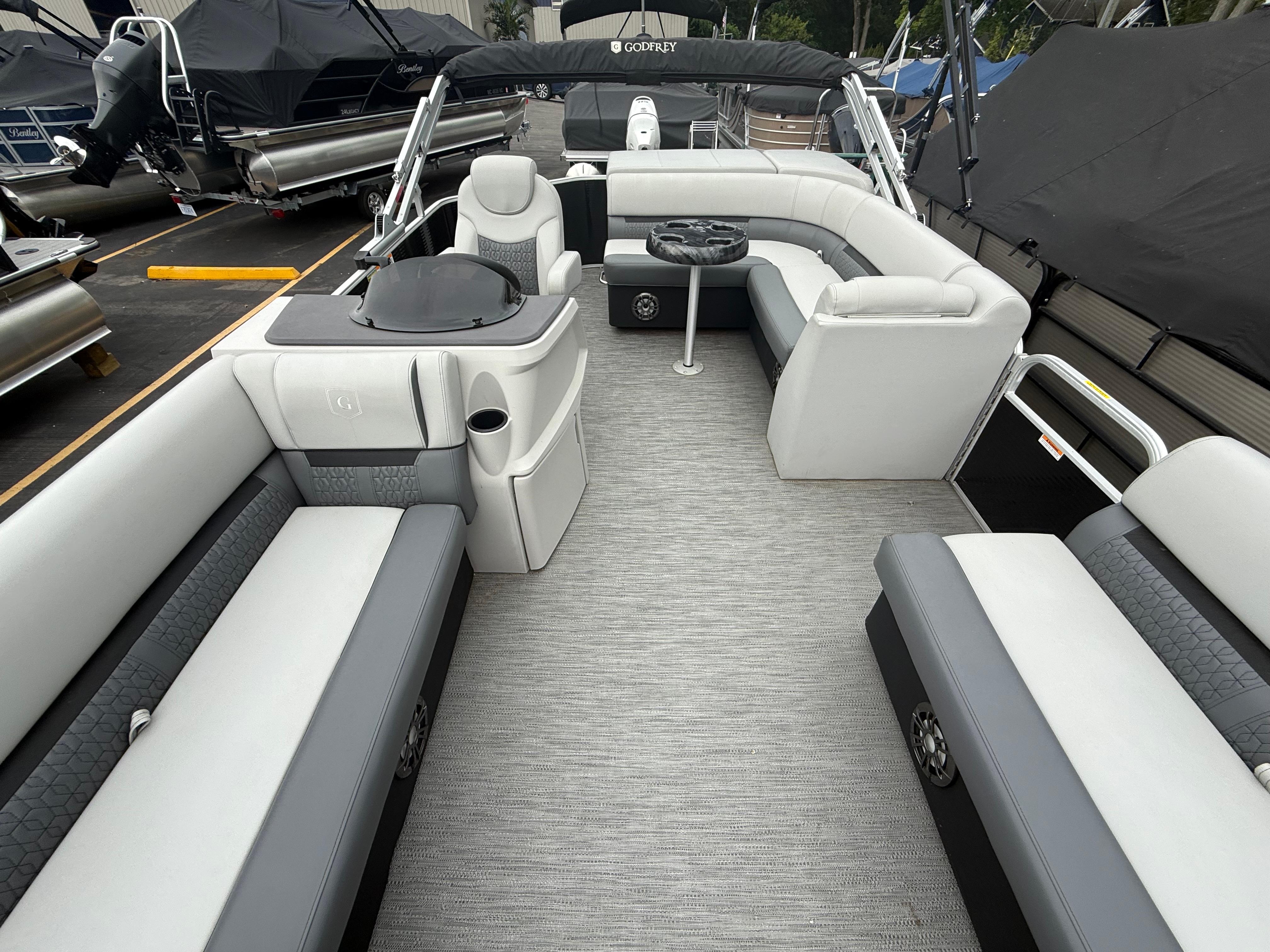 2023 Godfrey Sweetwater pontoon boat interior with luxurious seating and modern design.