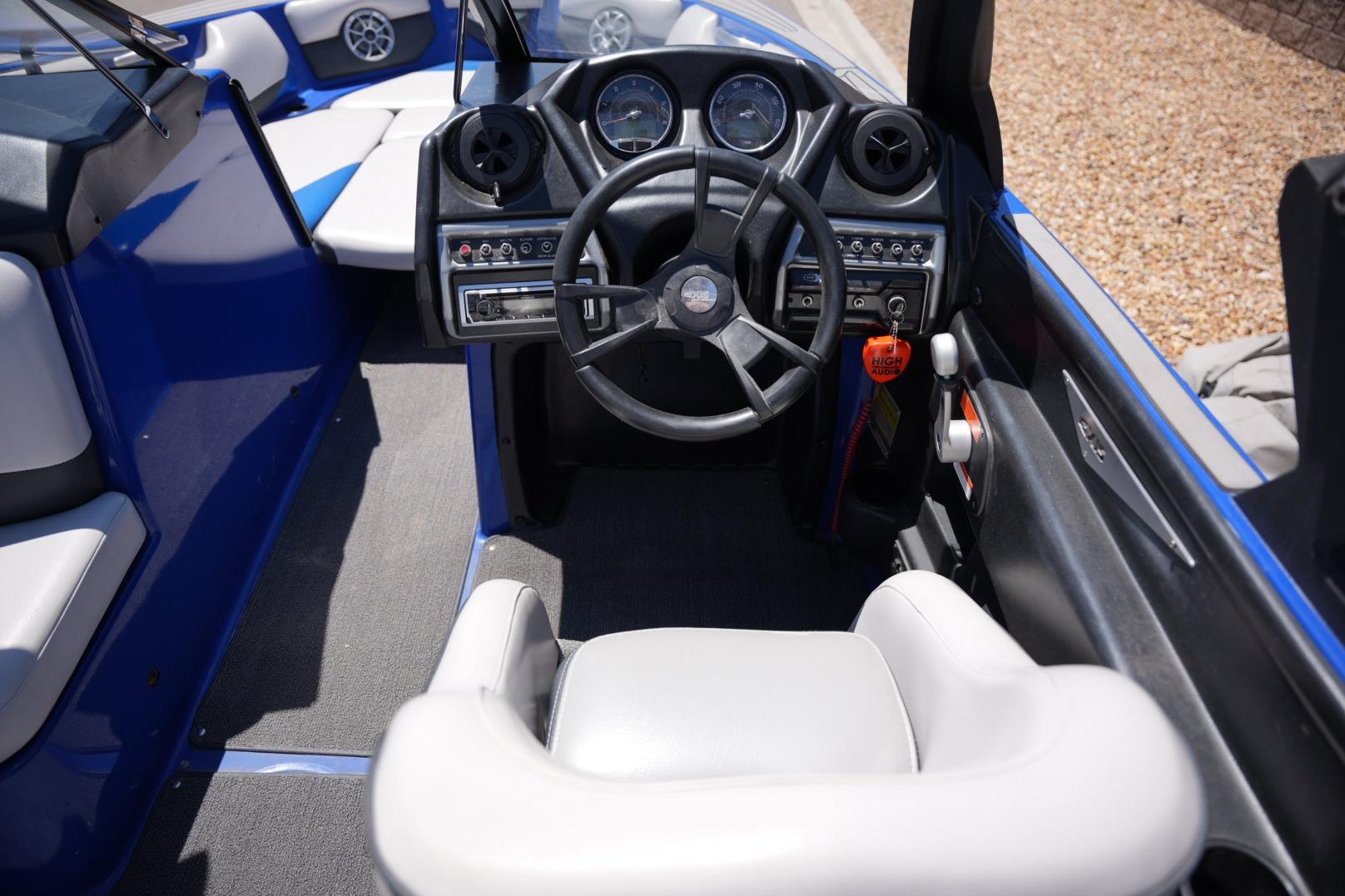 2015 Axis A24 boat interior with steering wheel and dashboard controls.