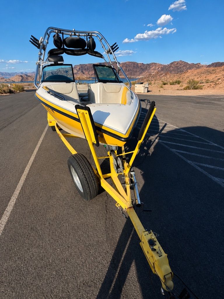 2003 Centurion Avalanche boat on trailer in desert landscape.