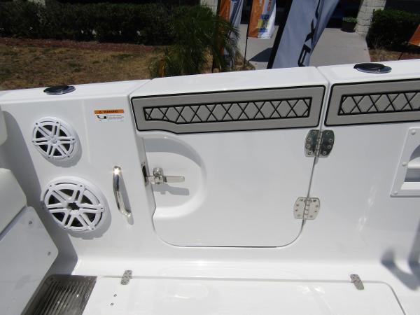2024 Wellcraft 352 Fisherman boat deck with speakers and storage compartments.
