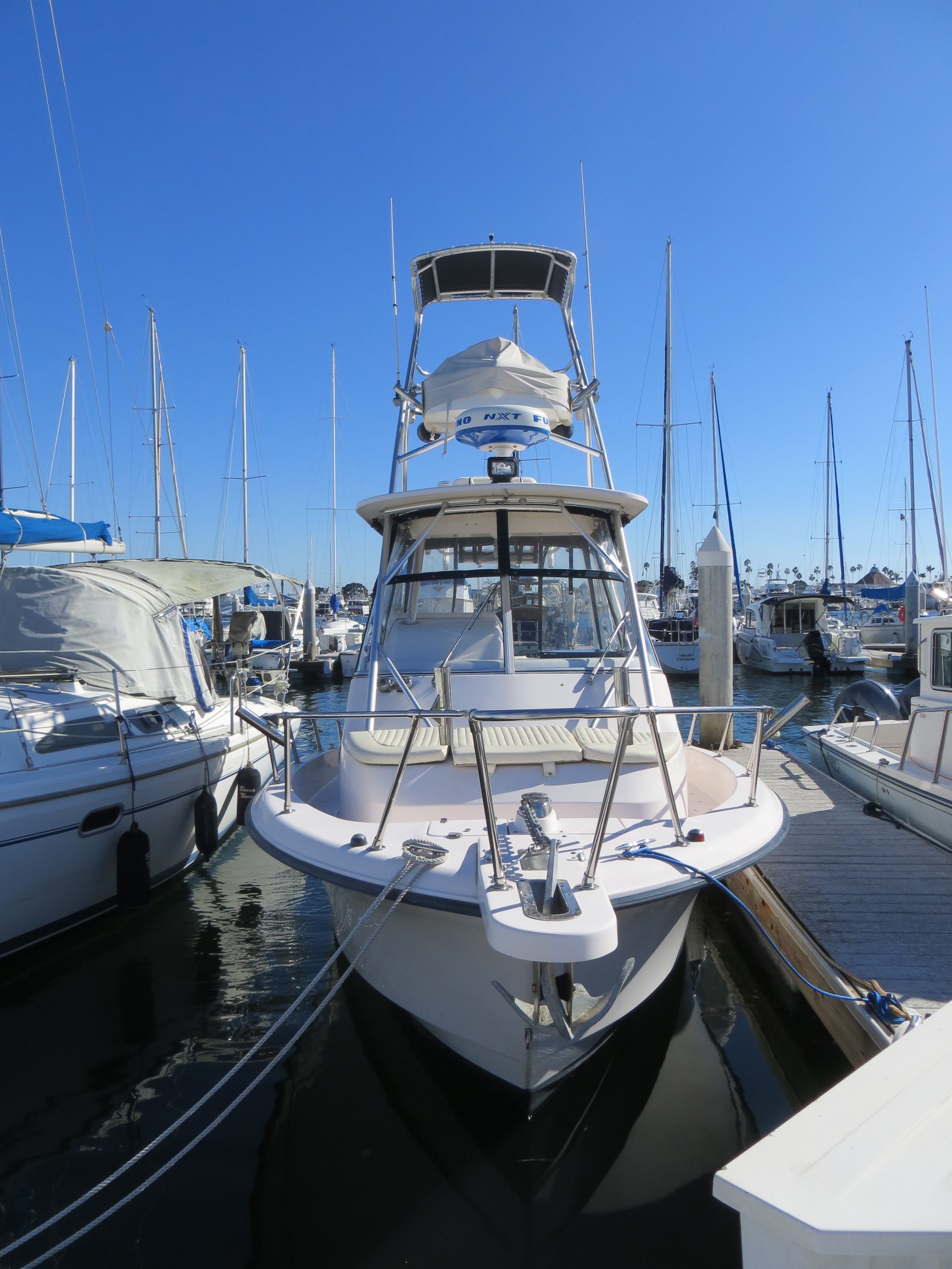 A 2007 Grady-White Sailfish 282 docked at a sunny marina.