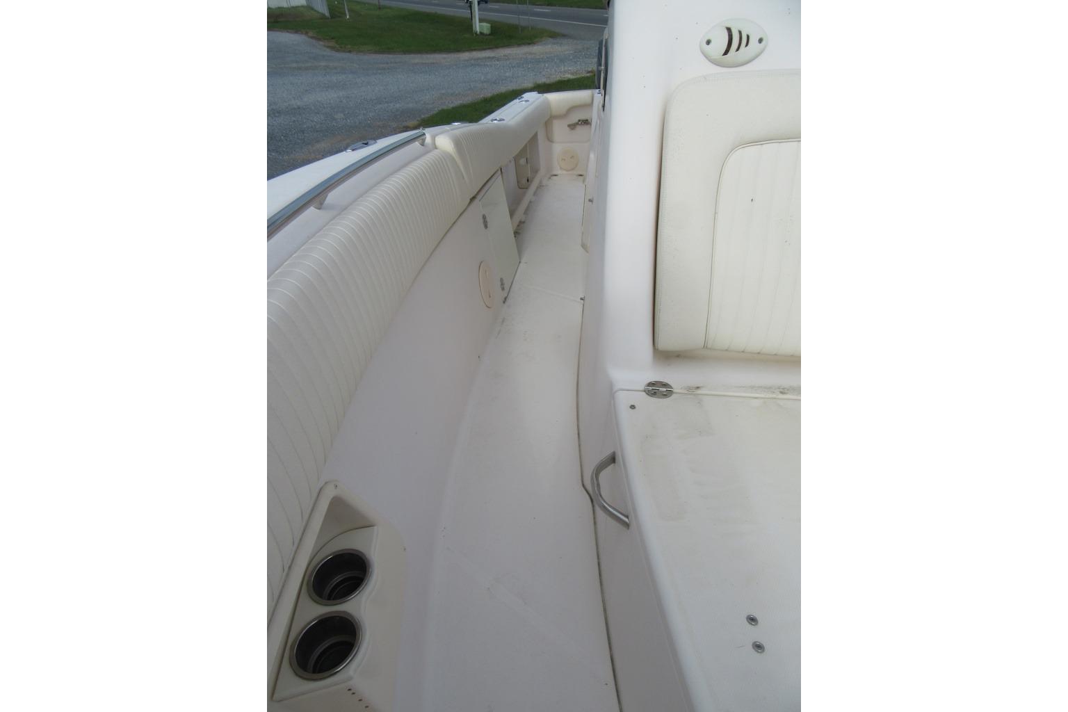 2012 Grady-White Canyon 271 boat interior with seating and cup holders.