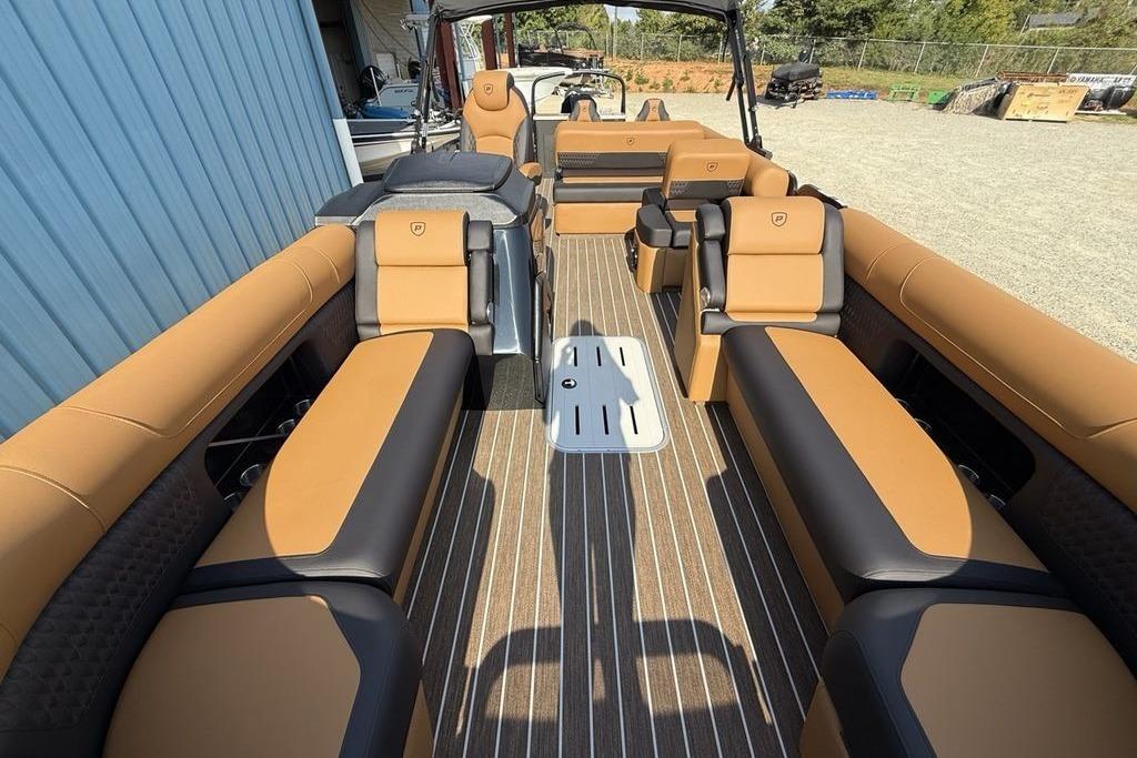 2026 Premier 250 Solaris RS CL pontoon boat with luxurious tan and black seating.