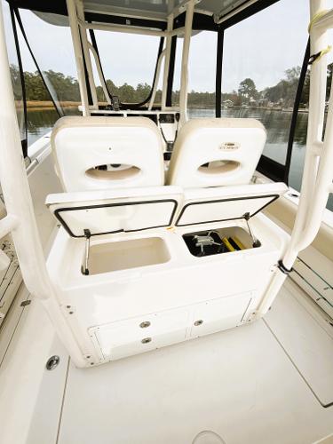 2016 Cobia 296 Center Console boat interior with open storage compartments.