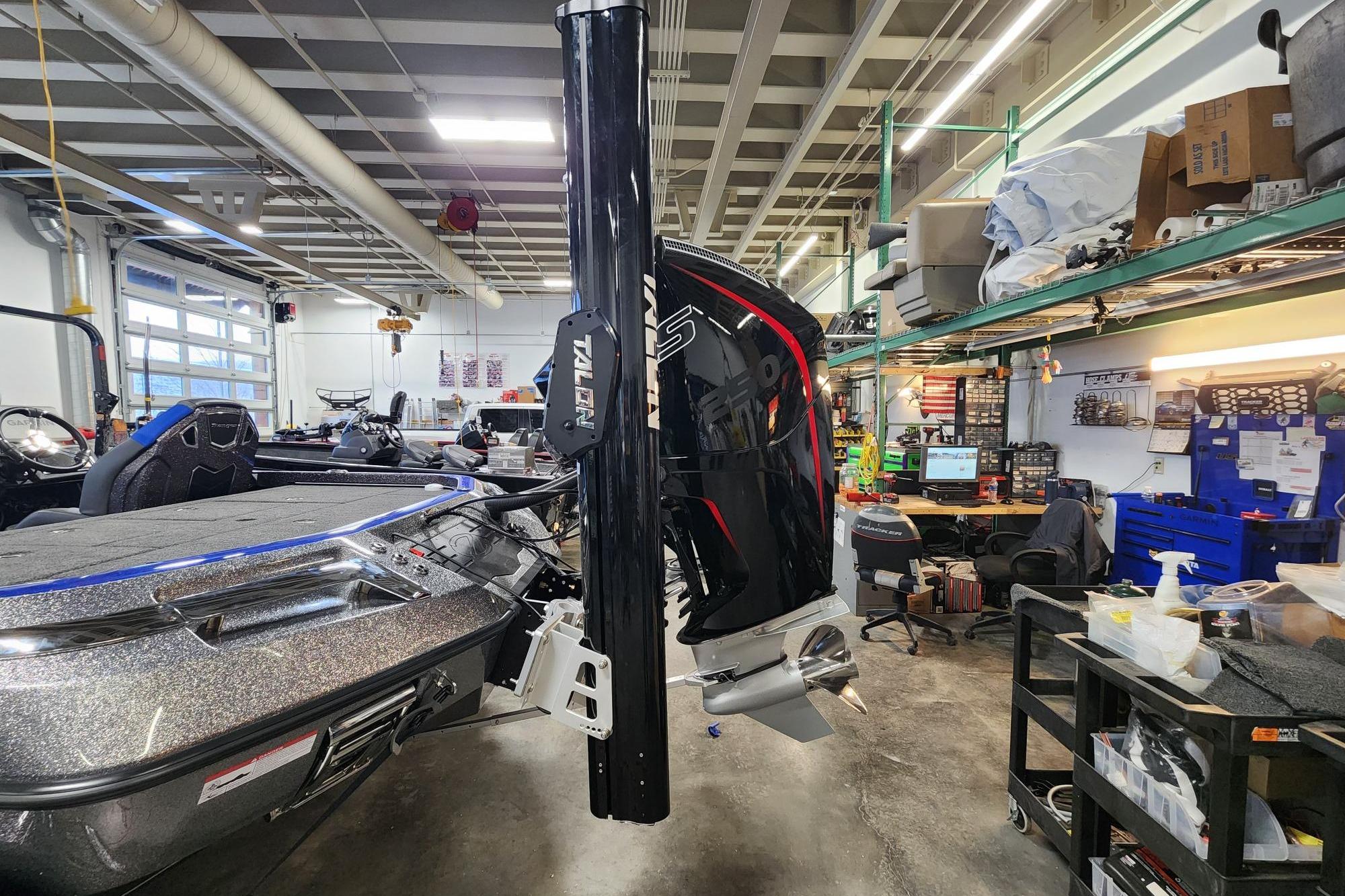 2025 Ranger Z521R boat in a workshop, featuring a powerful outboard motor.