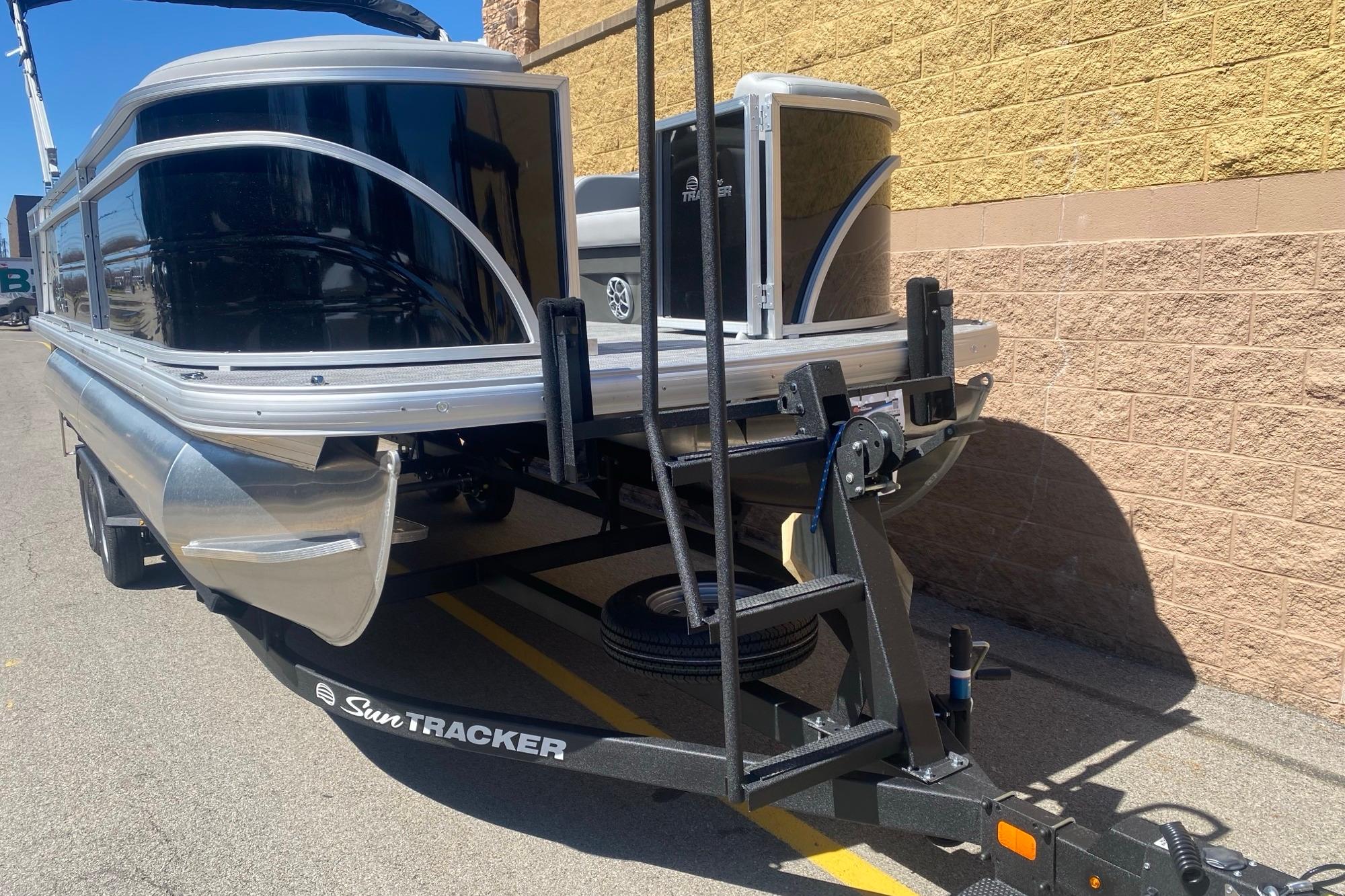 2026 Sun Tracker Party Barge 22 RF DLX pontoon boat on trailer.