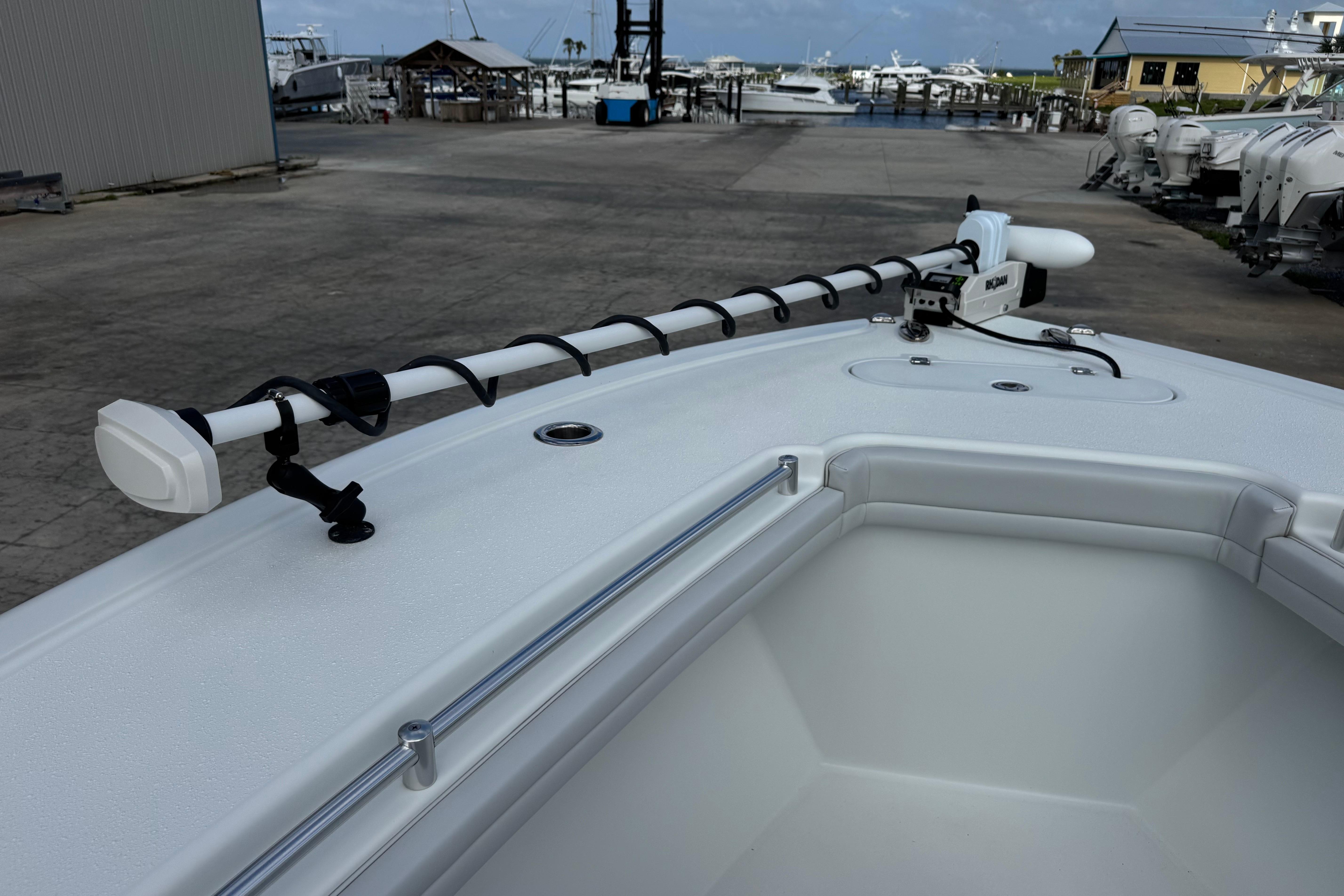 2022 Yellowfin 32 Offshore boat deck with mounted equipment at marina.