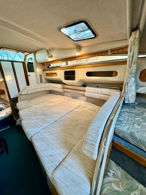 Interior of the 1992 Sea Ray 290 Sundancer with cozy seating and skylights.