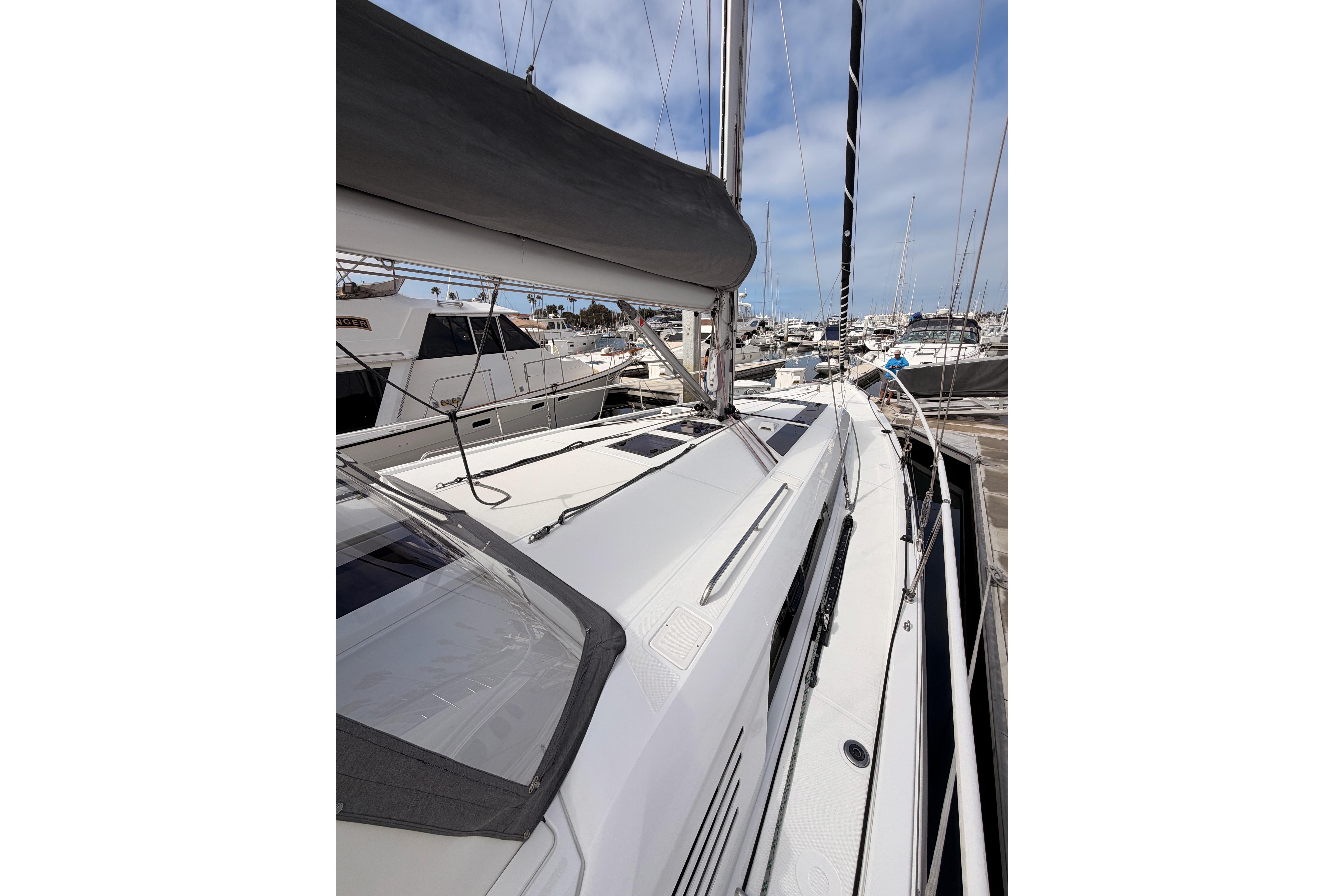2020 Beneteau Oceanis 46.1 sailboat docked at marina, showcasing sleek deck design.