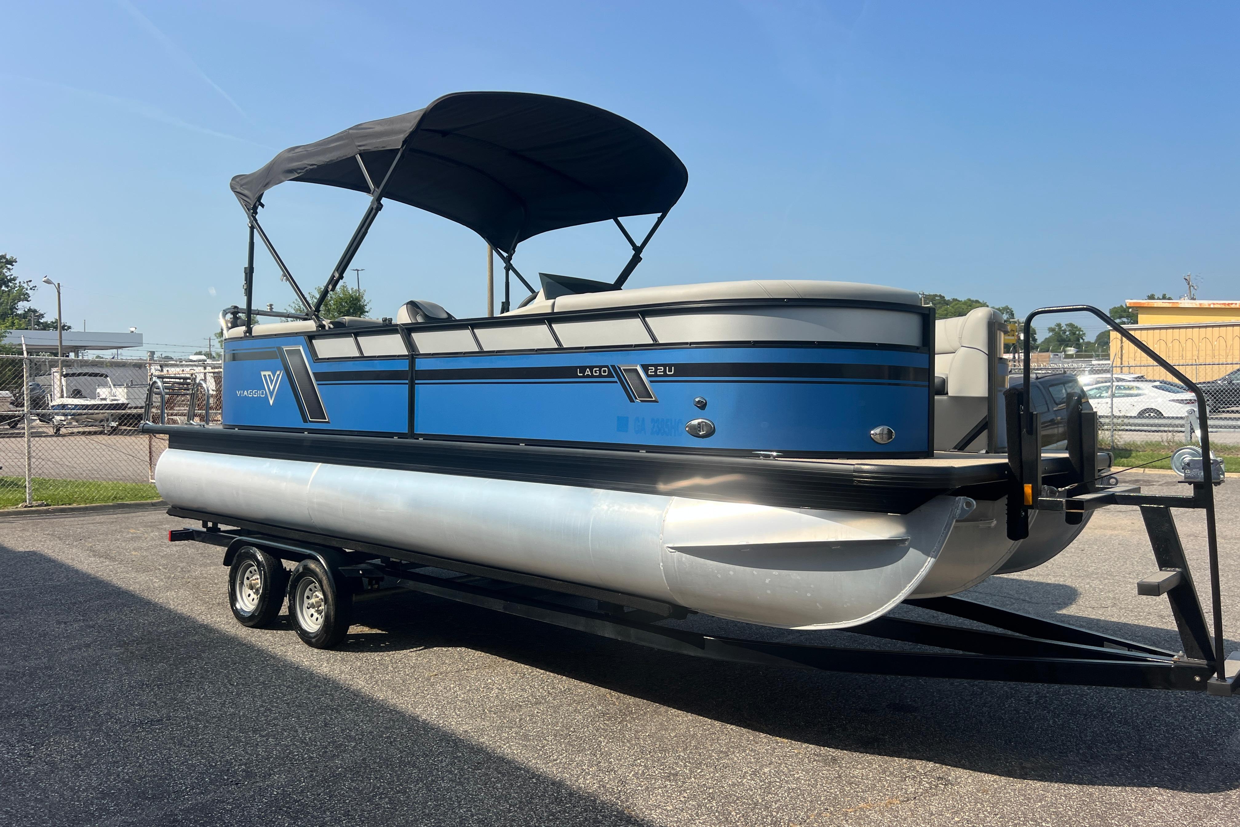 2022 Viaggio Lago V-U 22 pontoon boat on trailer, blue and silver design.