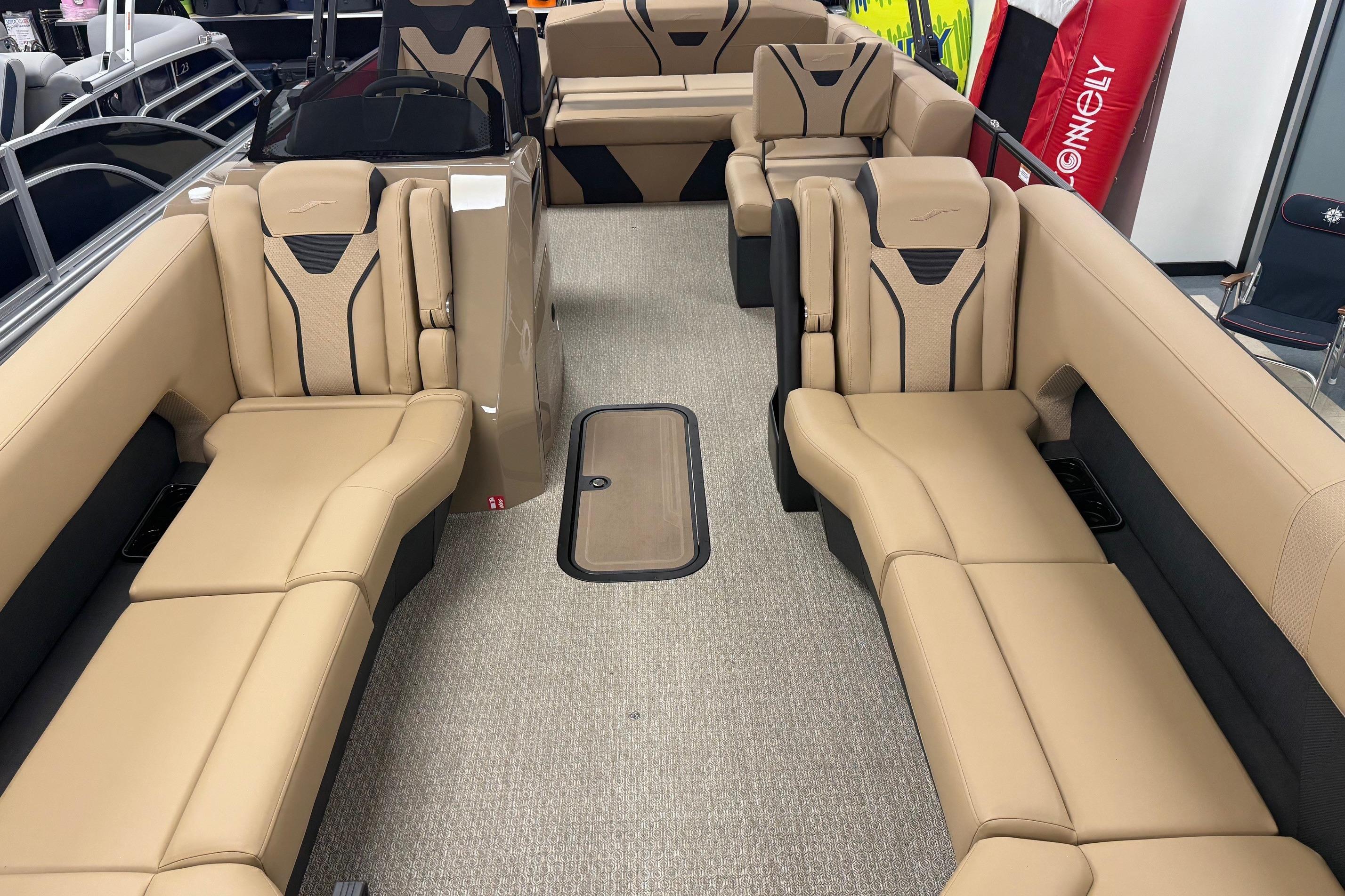 Luxurious interior of 2026 Evotti 725CS boat with beige seating and modern design.