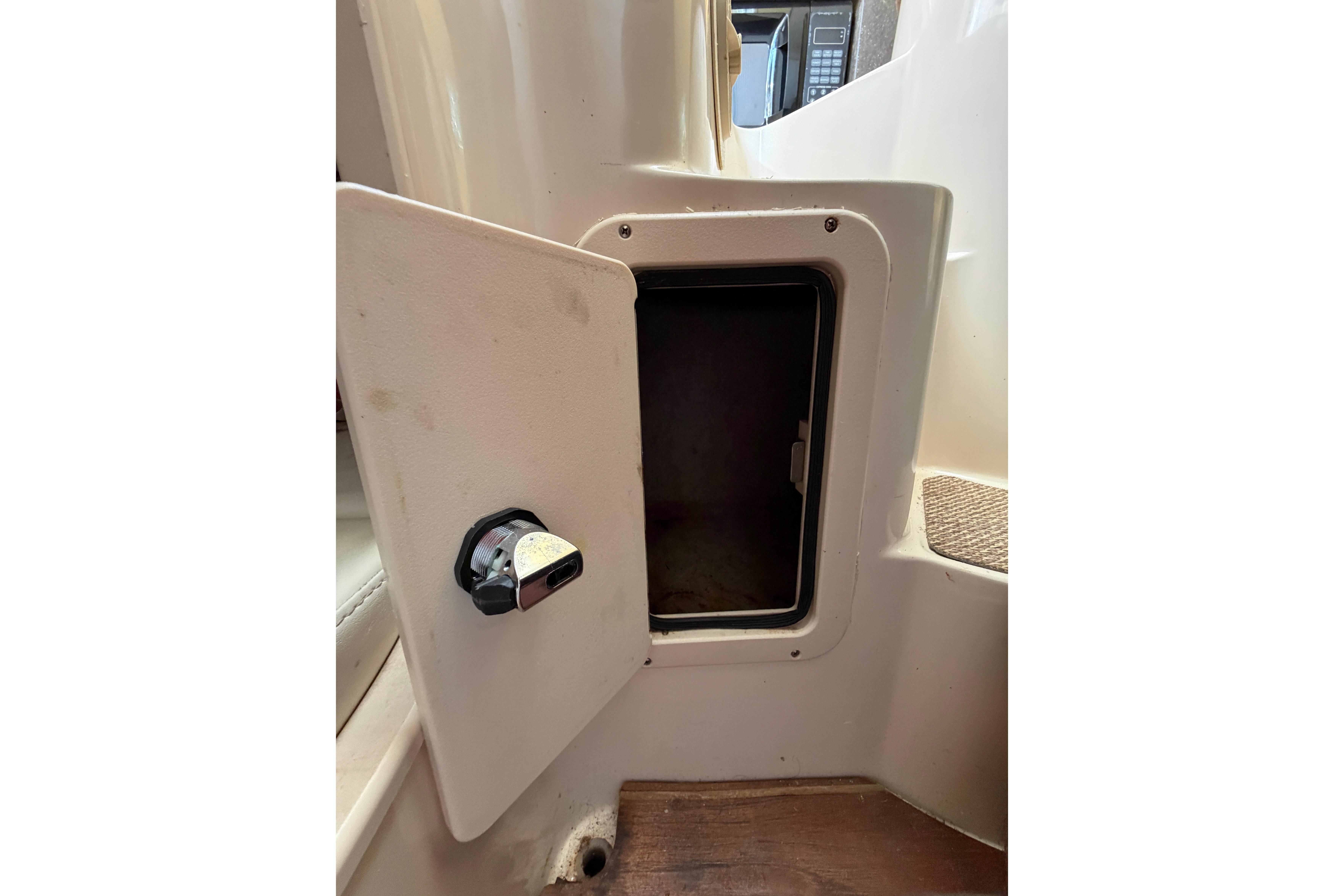 Open storage compartment on 2006 Grady-White Sailfish 282 boat interior.