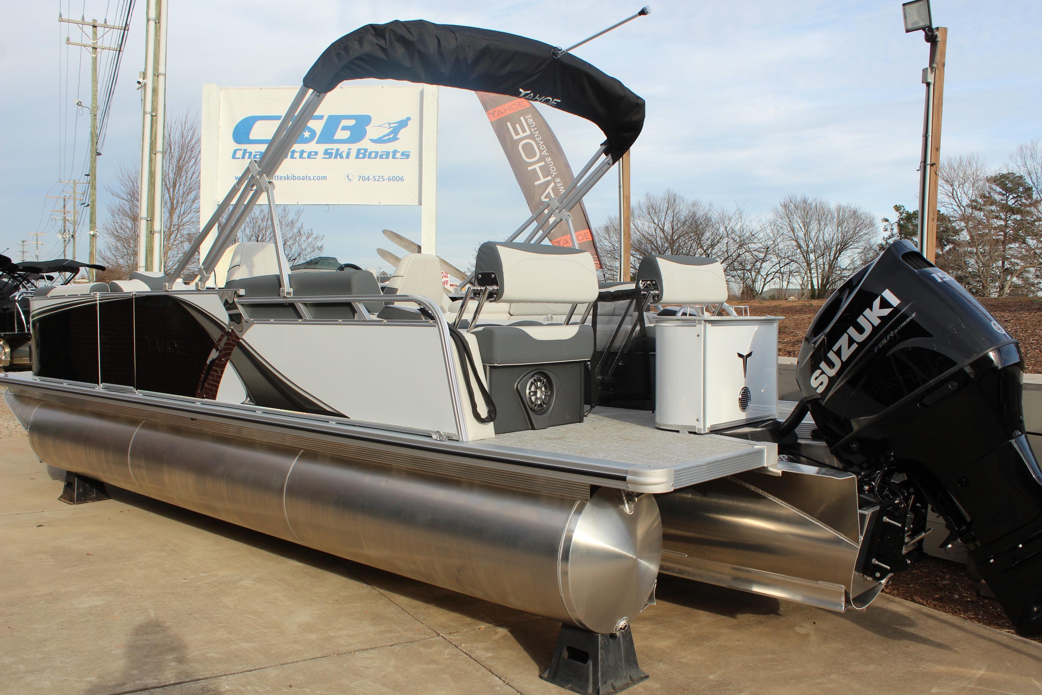 2026 Tahoe Pontoon LTZ boat with Suzuki engine at Charlotte Ski Boats dealership.