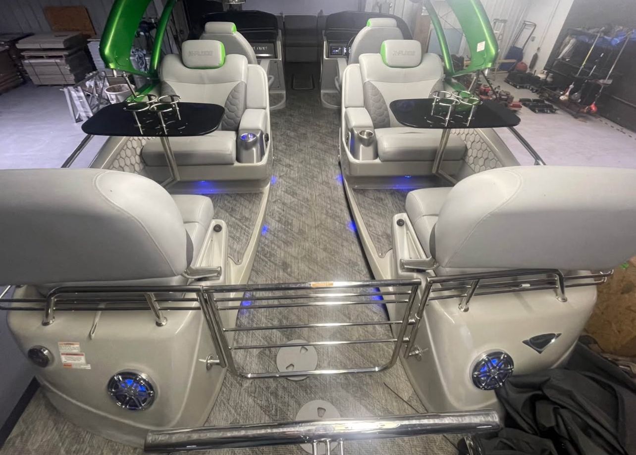 Interior of a 2020 Manitou 27 X-Plode SHP with modern seating and blue lighting.