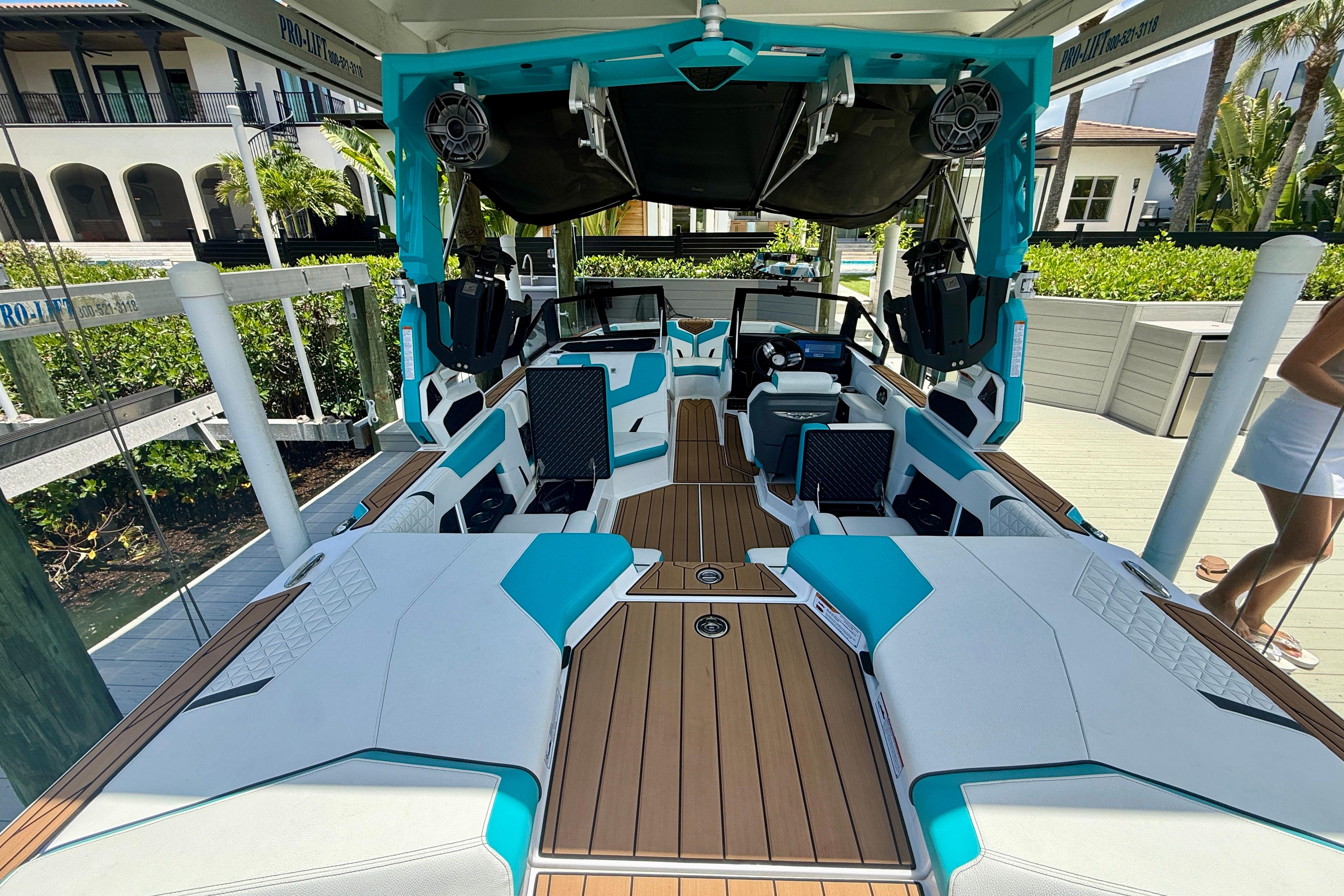 2024 Nautique Super Air Nautique GS20 boat interior with modern design and teal accents.