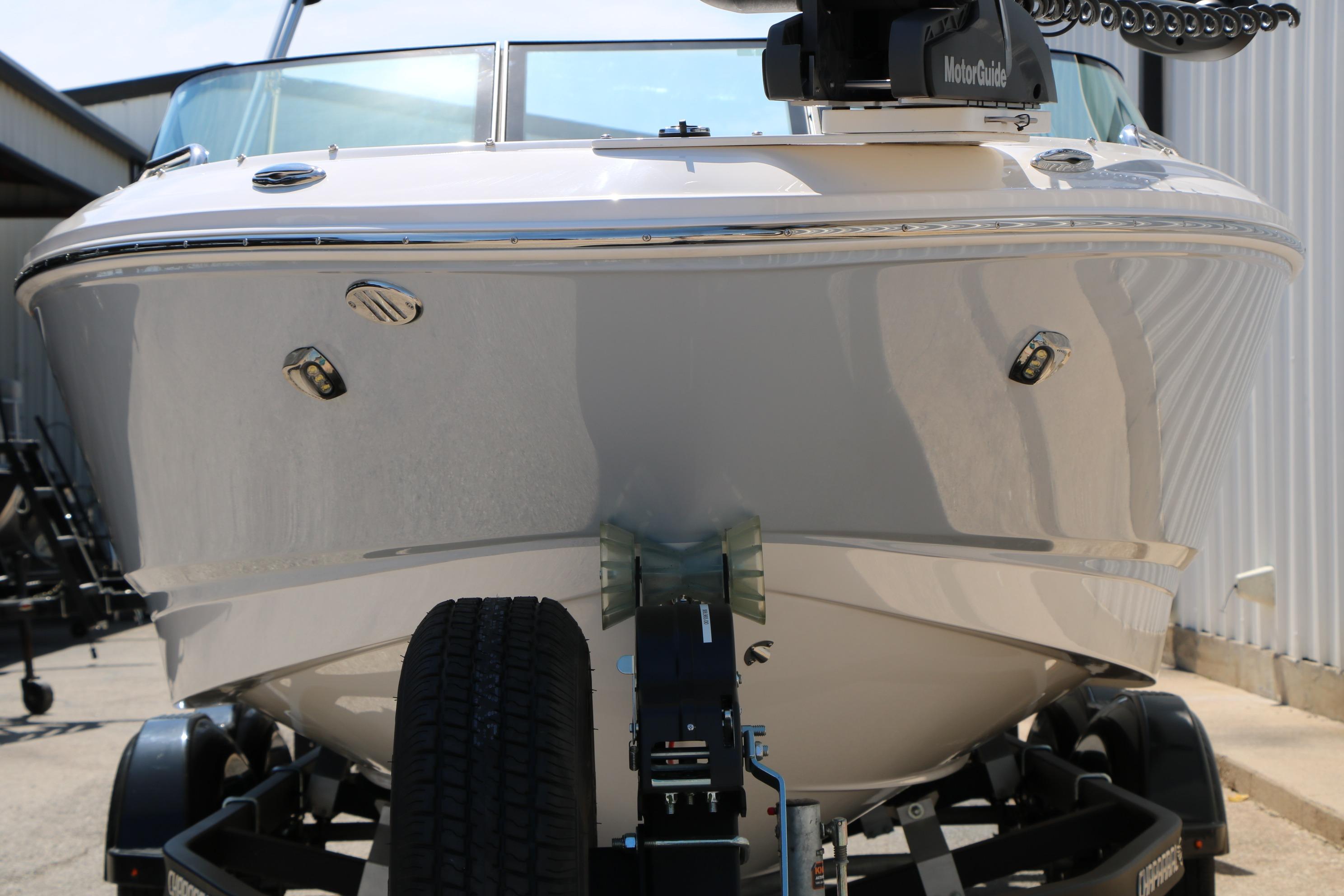 2025 Chaparral 21 SSi Ski & Fish boat on trailer, front view.