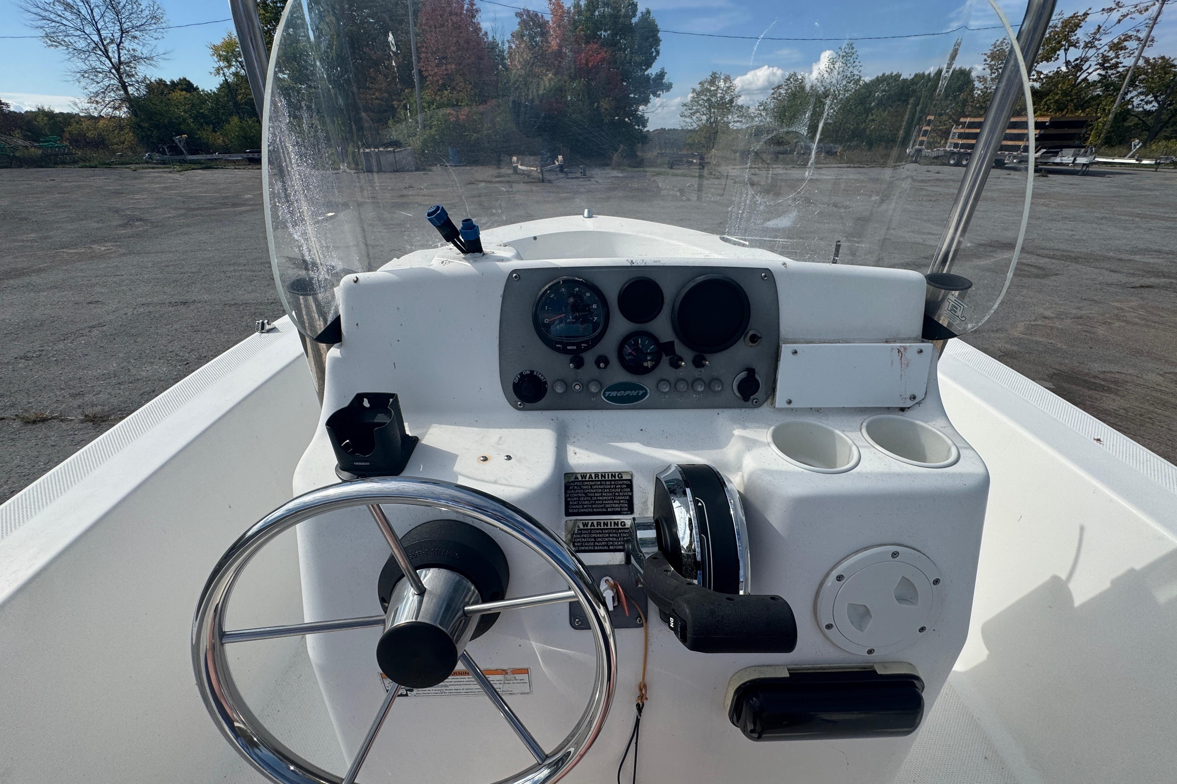 2007 Trophy 1703 Center Console boat dashboard with steering wheel and instrument panel.