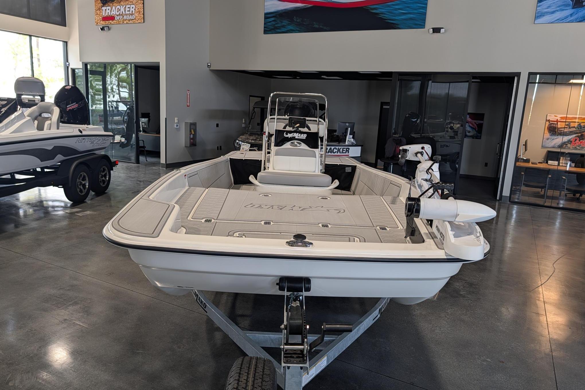 2026 Mako Pro Skiff 17 CC boat displayed in showroom on trailer.