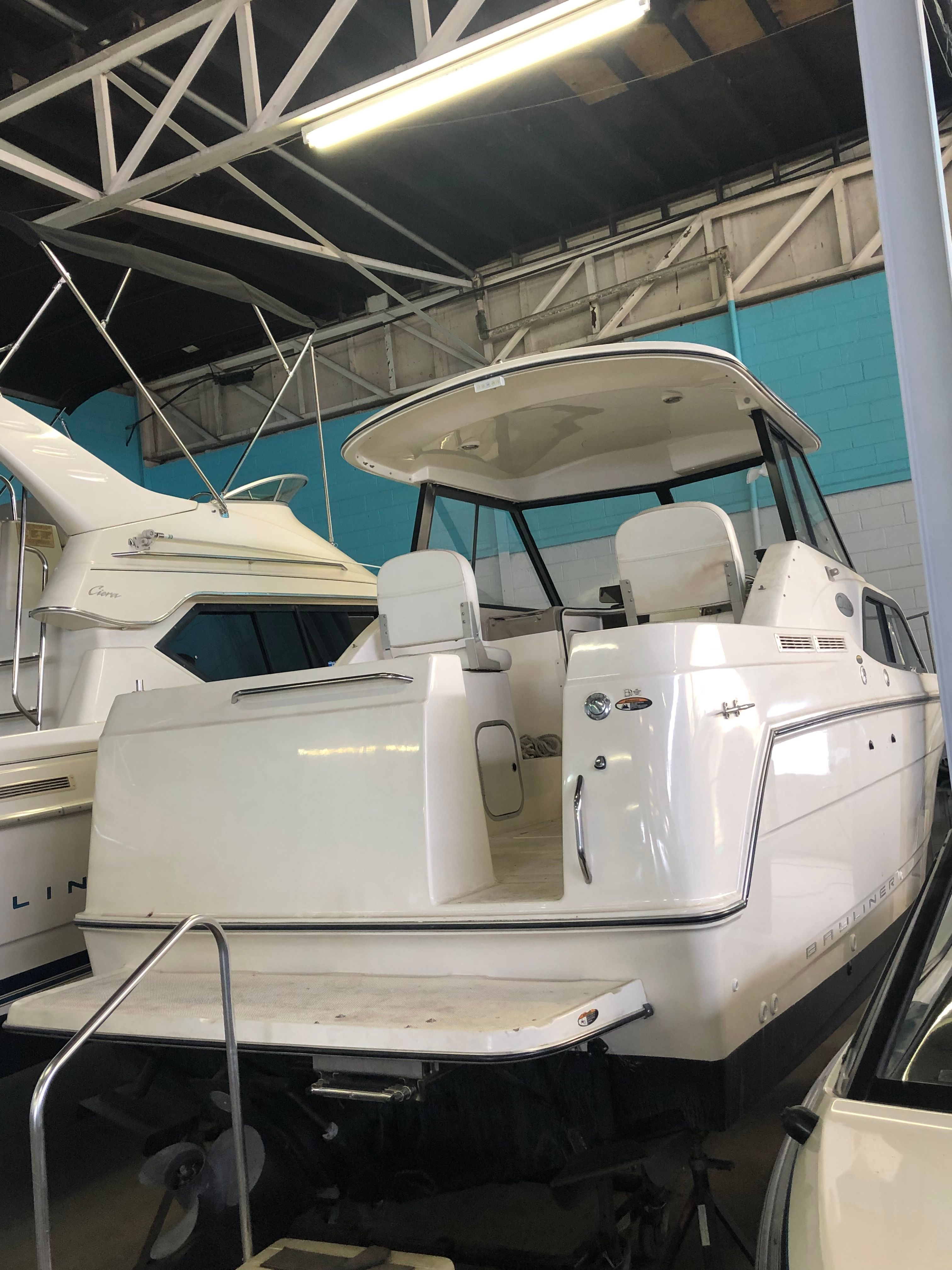 2003 Bayliner 2452 Classic Cruiser in a storage facility.