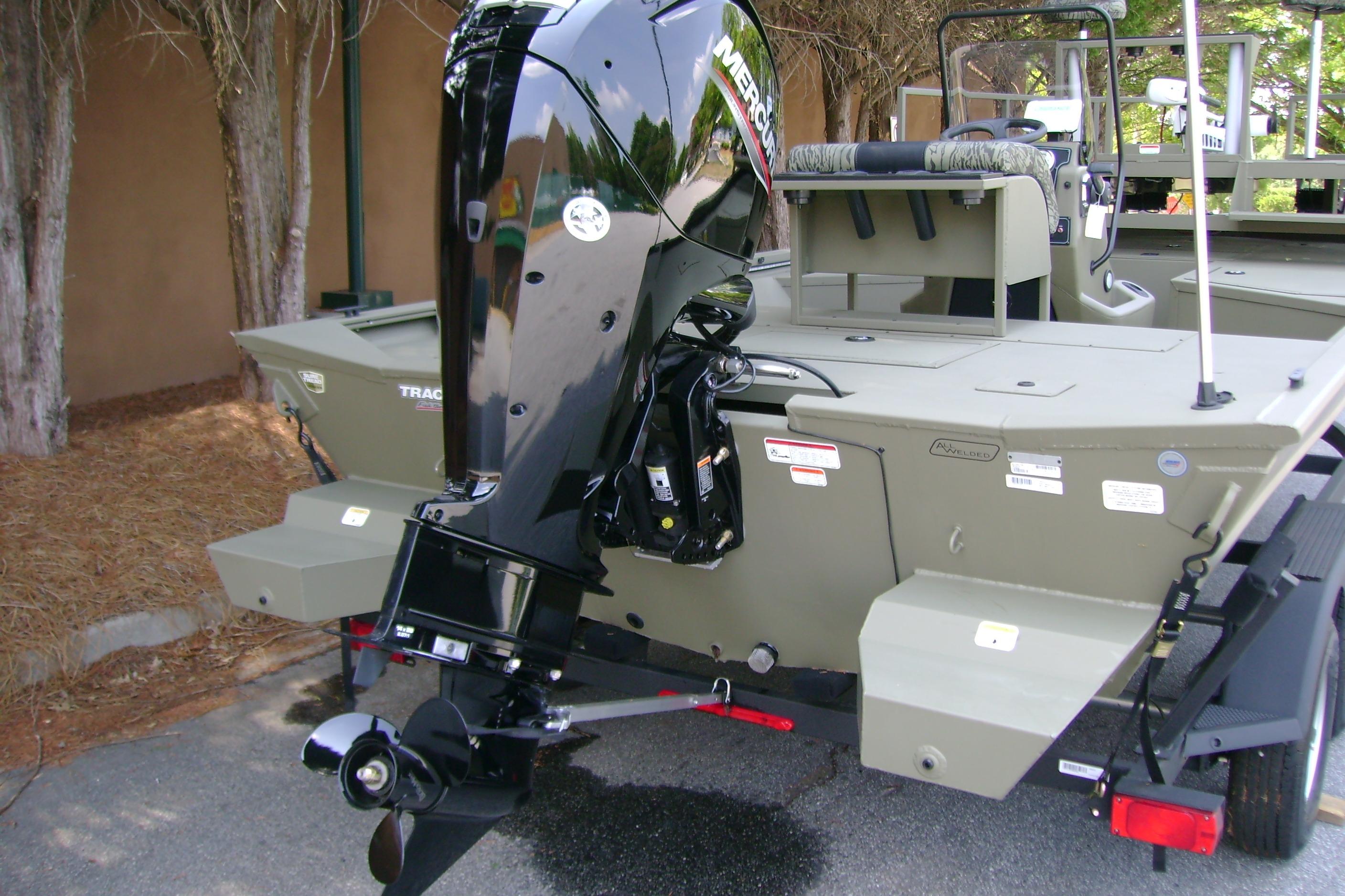 2026 Tracker Grizzly 2072 CC Sportsman boat with powerful Mercury outboard motor.