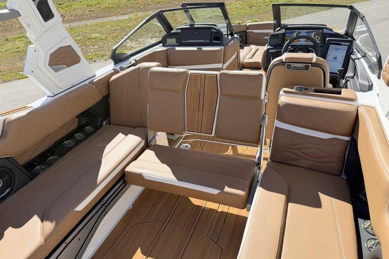Luxurious interior of 2026 Supra SL boat with tan leather seating and modern dashboard.