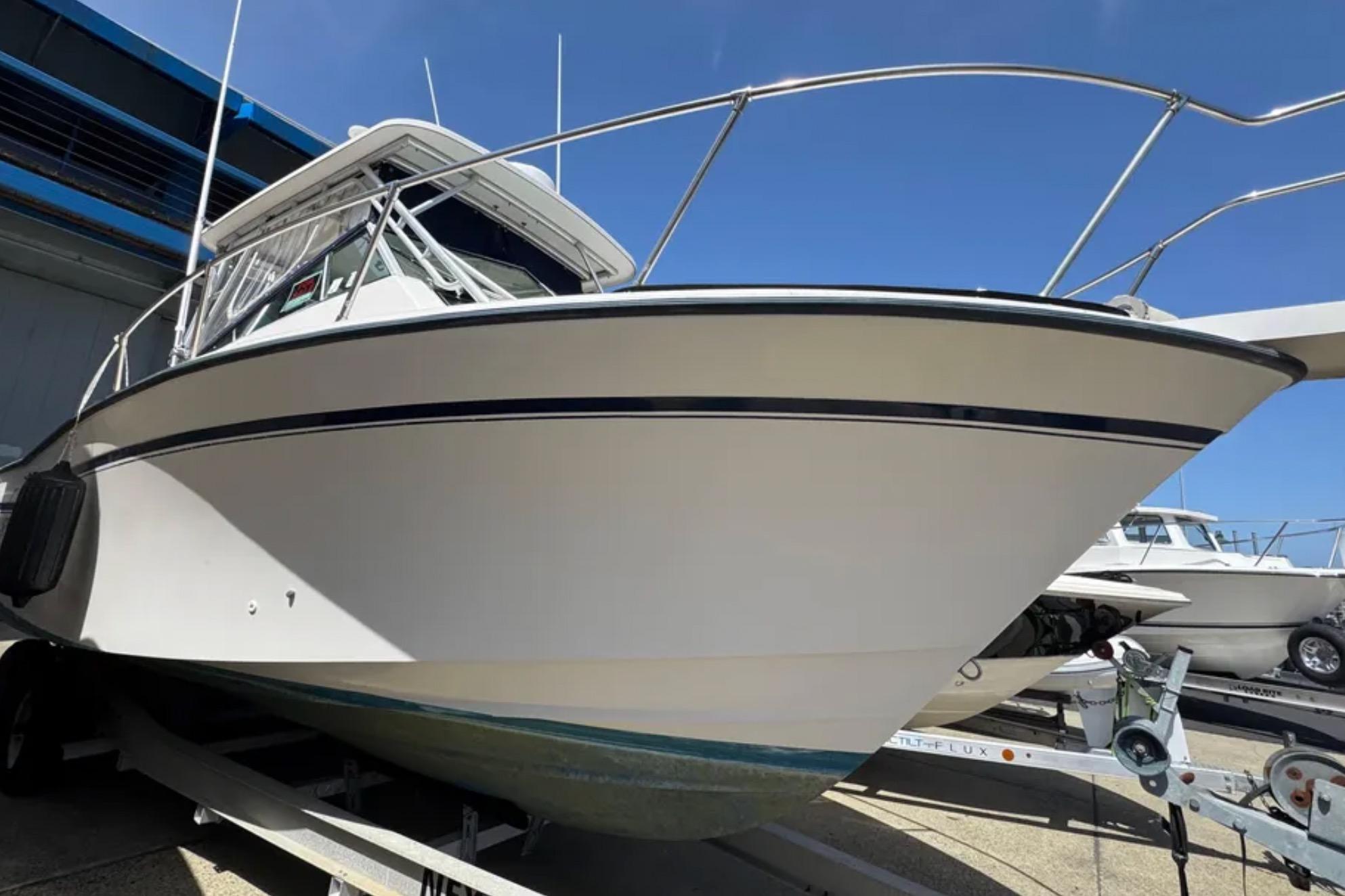 1990 Grady-White Marlin 280 boat on trailer, viewed from the front-left angle.