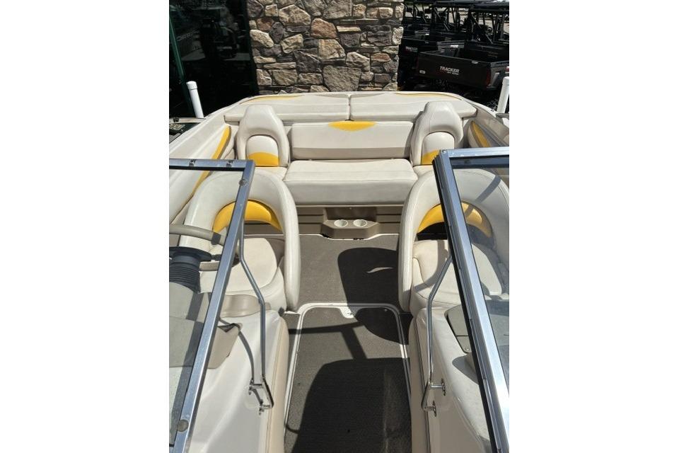 2003 Glastron GX 185 Ski & Fish boat interior with beige and yellow seating.