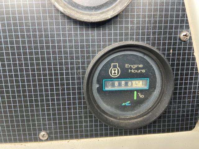 1989 Sea Ray 300 Sedan Bridge engine hours gauge showing 8887.4 hours.