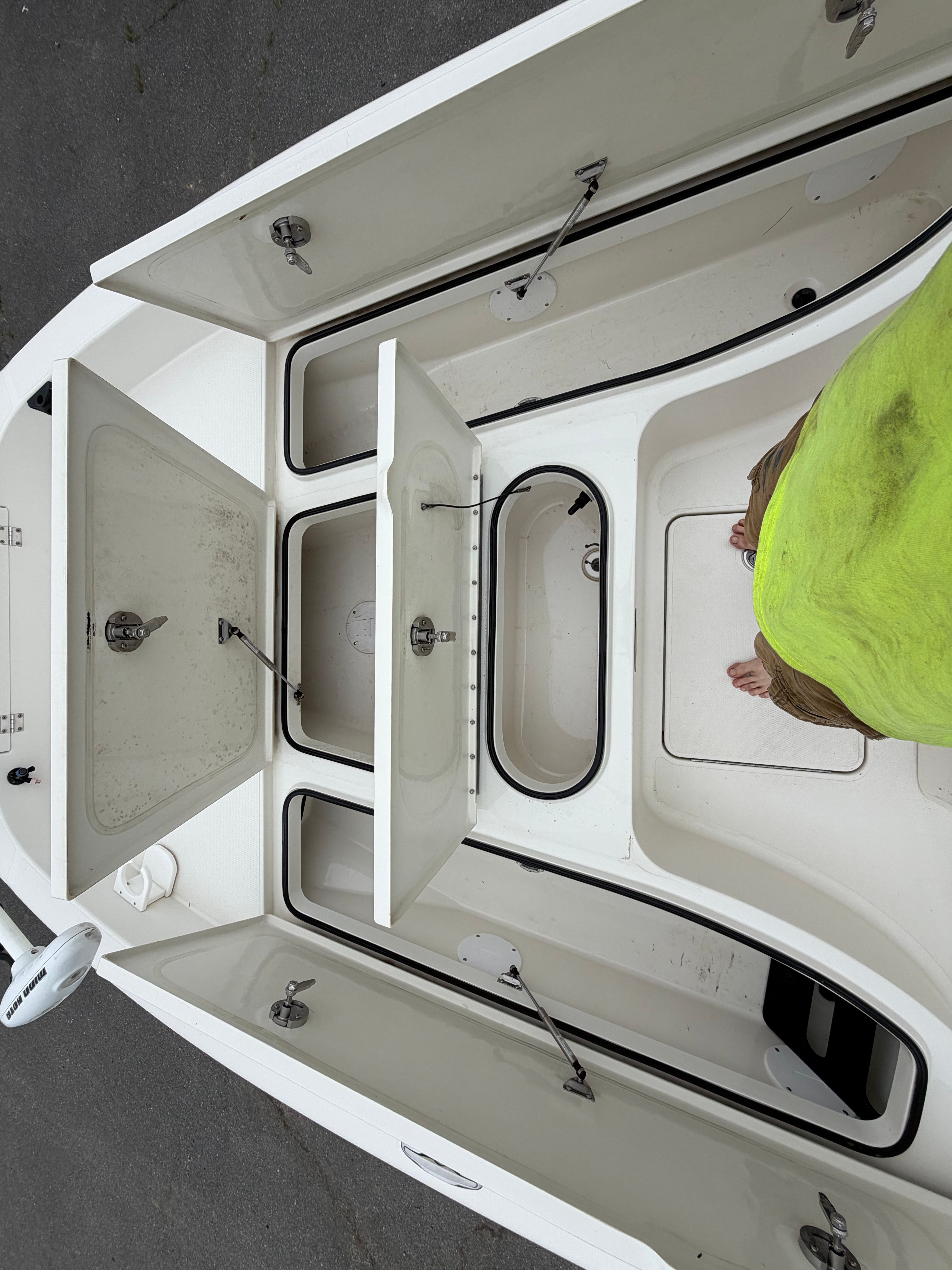Interior view of a 2008 Ranger 2400 Bay Ranger boat with open storage compartments.