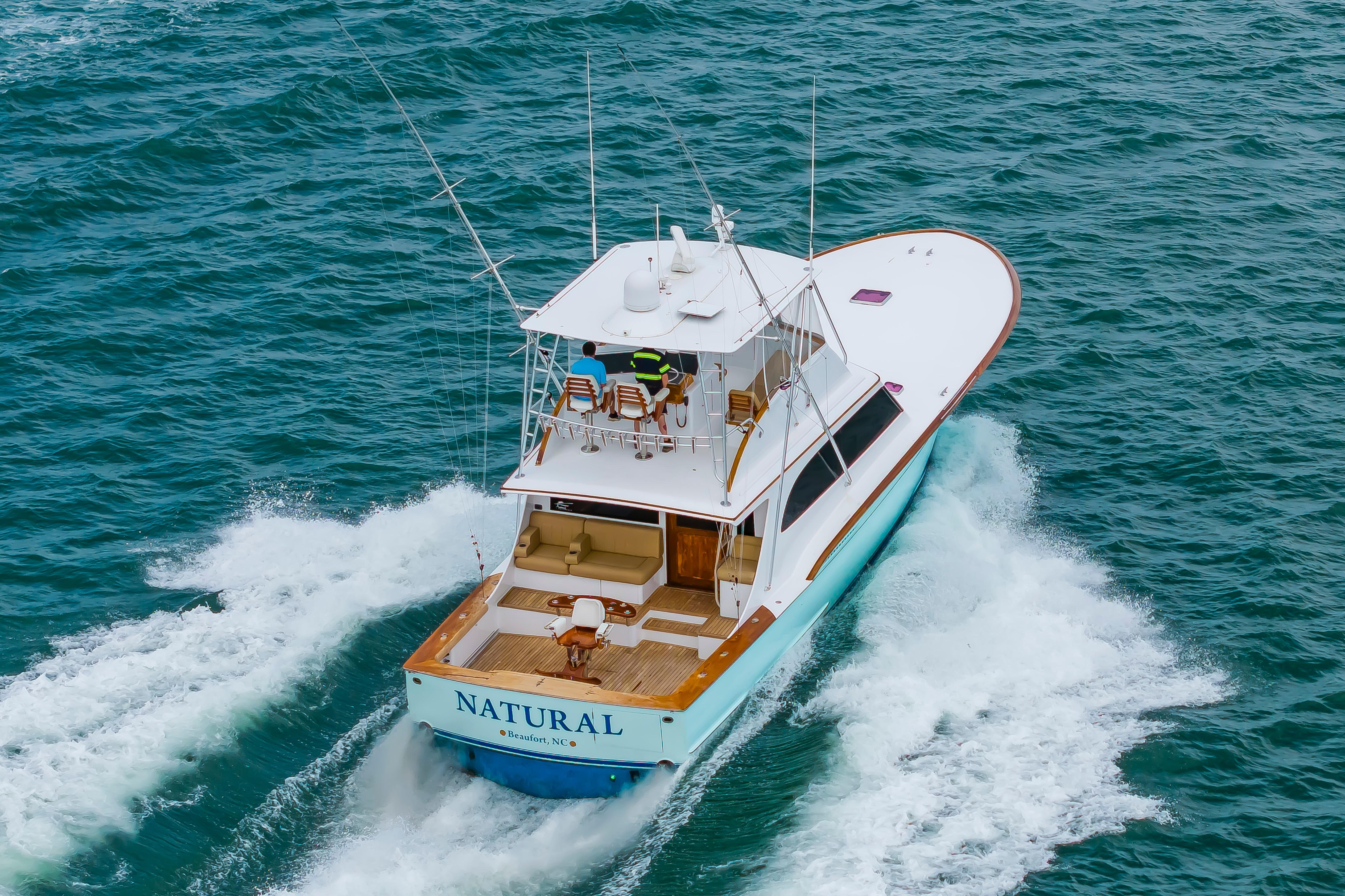 Custom Carolina Scarborough 56 Convertible yacht cruising on open water, 1993 model.