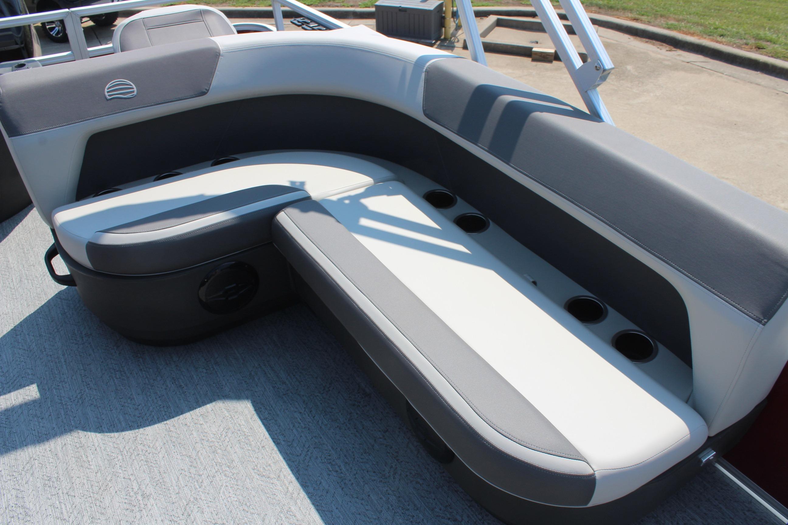 2026 Sun Tracker Bass Buggy 18 DLX boat seating with cup holders, gray and white upholstery.