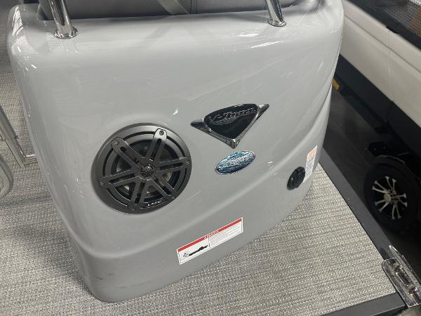 2025 Manitou LX boat interior with speaker and logo details.