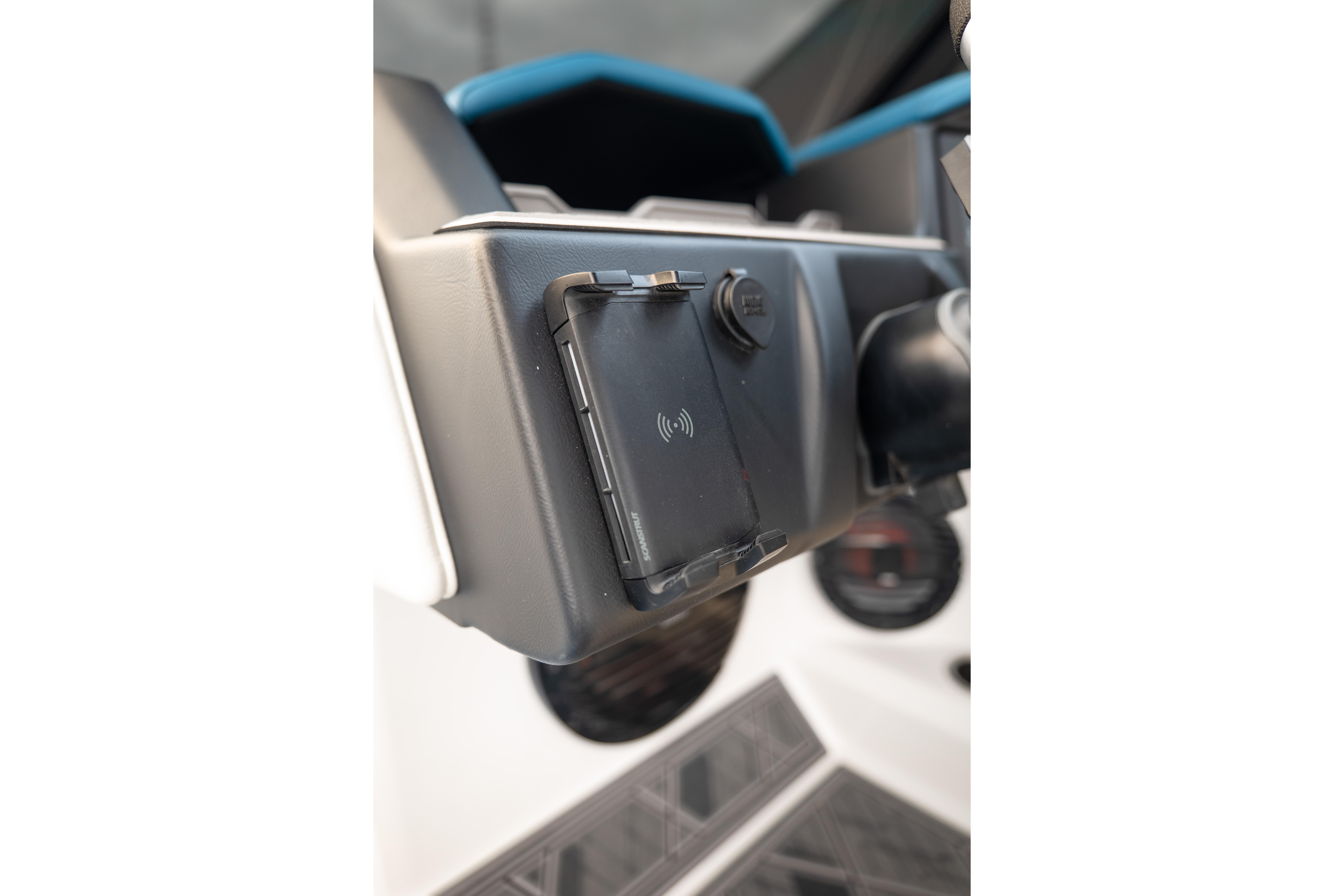 2024 Tigé Z5 dashboard with wireless charging pad and control panel.