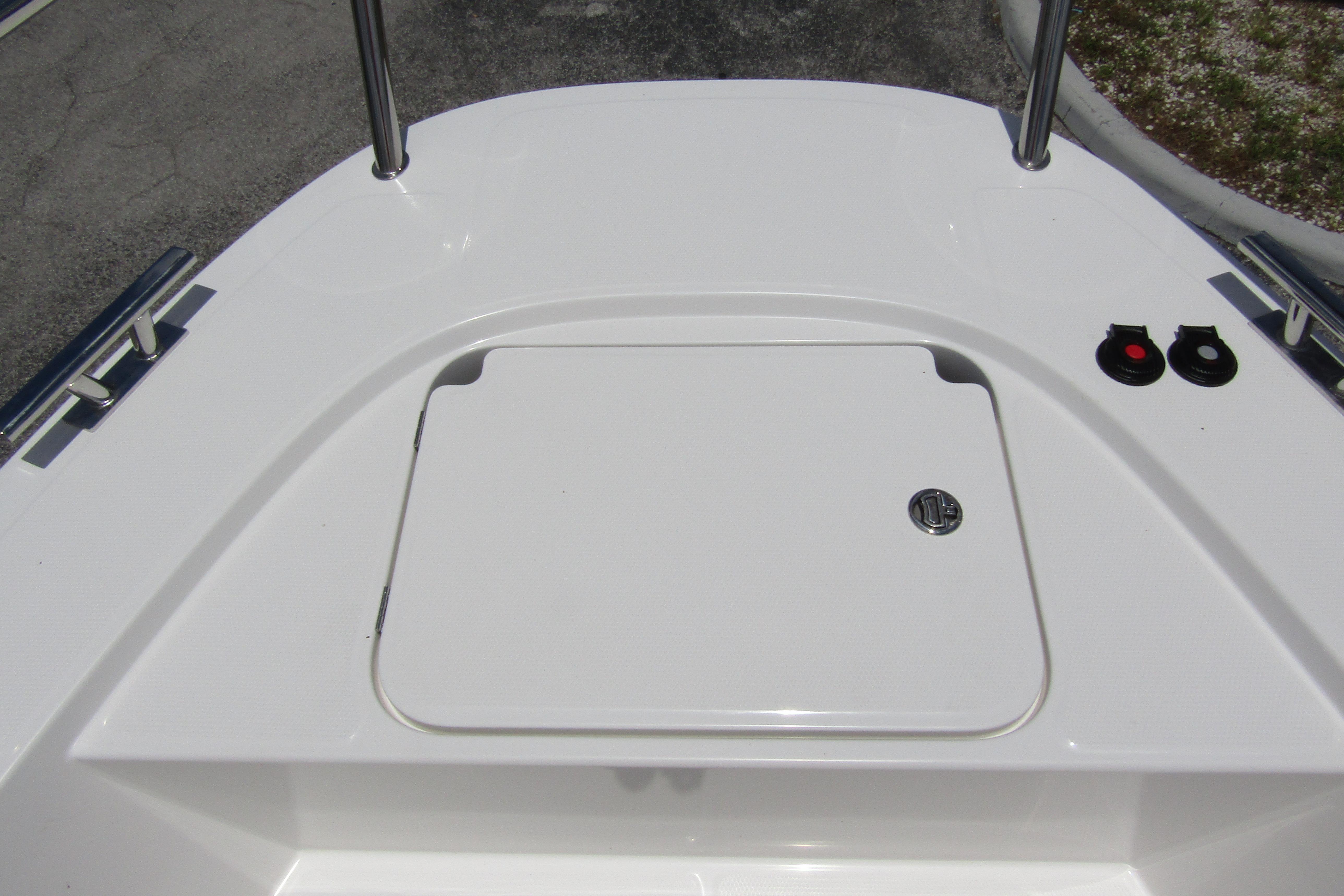 2025 Nimbus Tender 11 boat deck with storage hatch and railing.